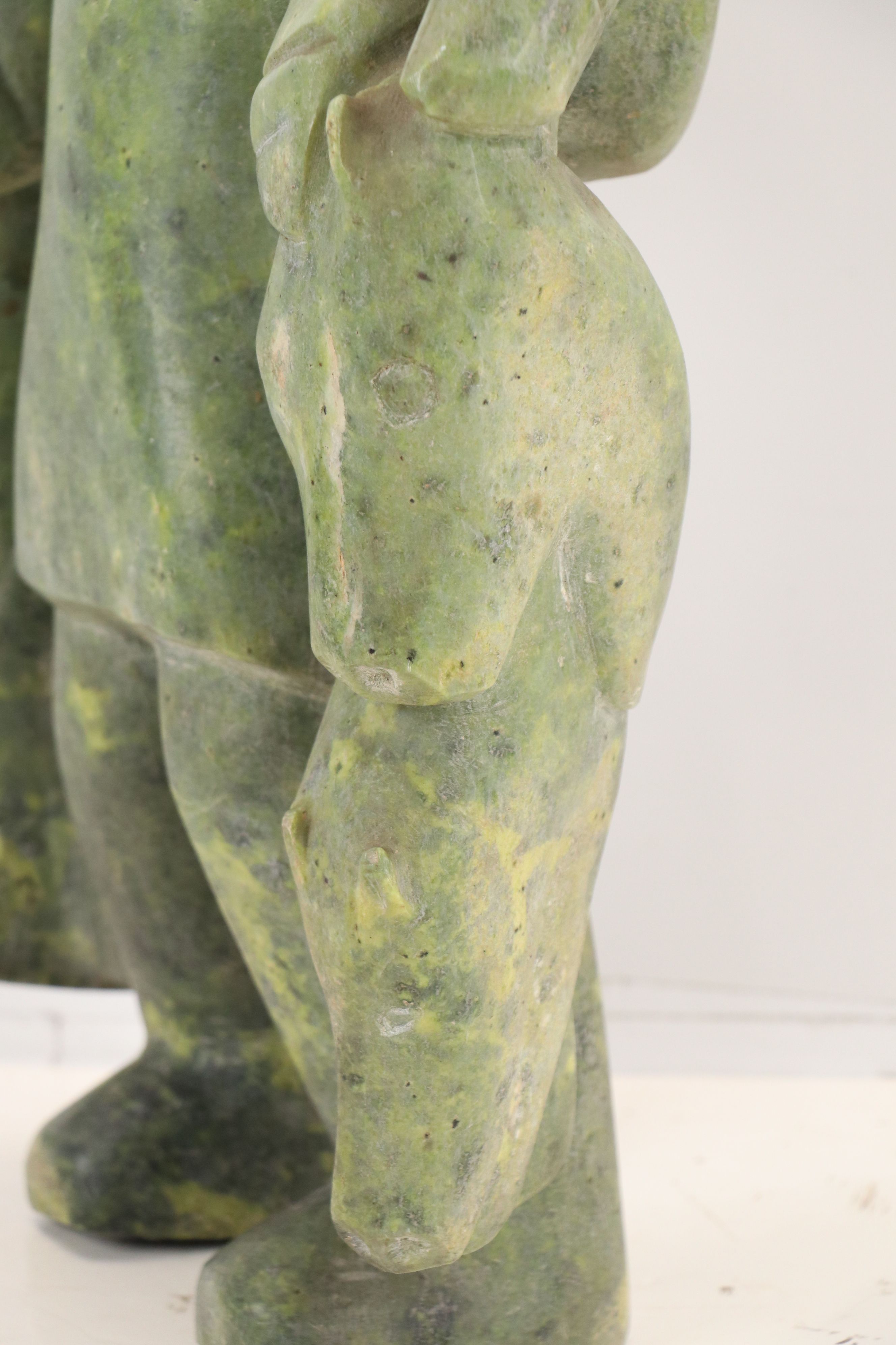 Carved Serpentine Sculpture of Inuit Hunter with Fish, Mid-20th Century