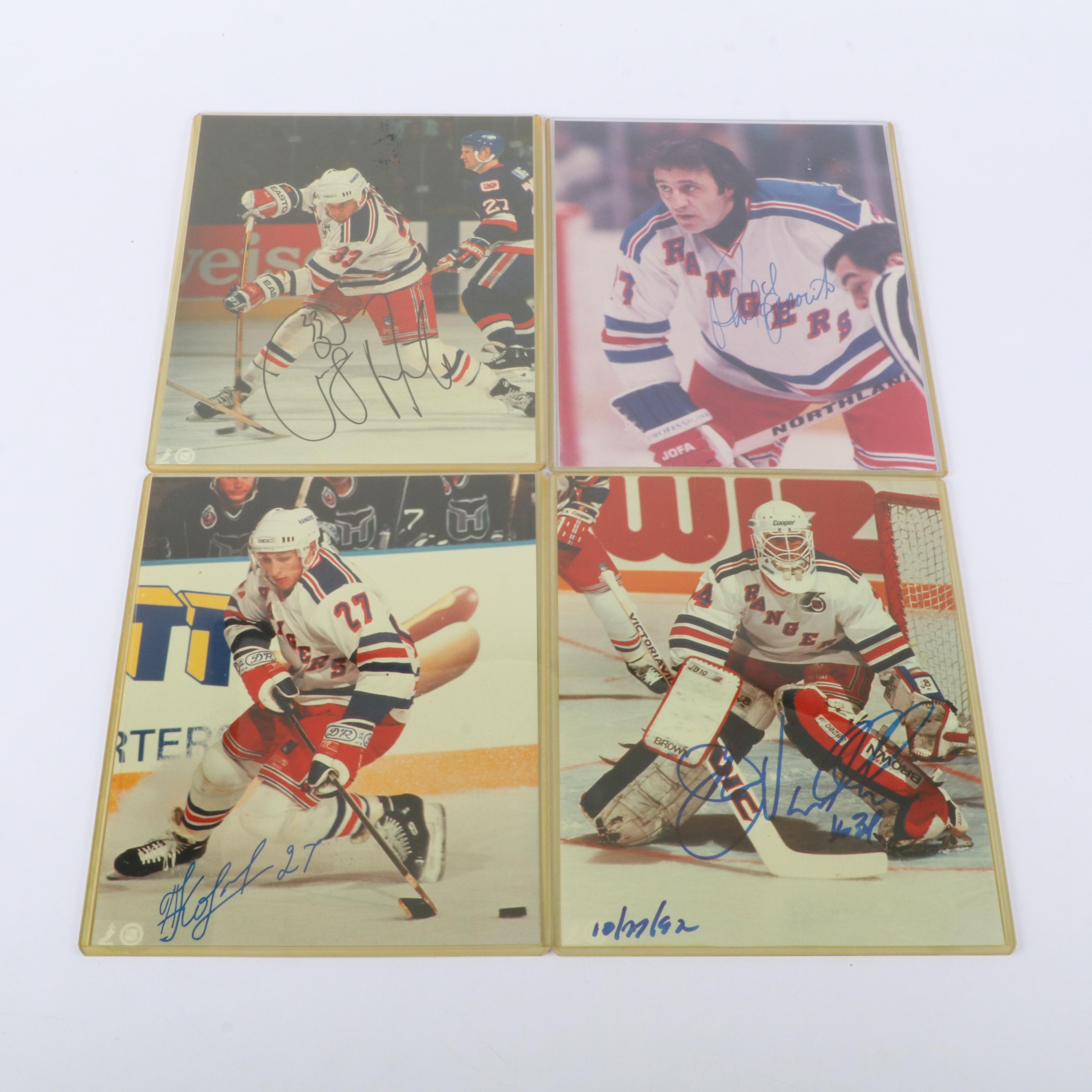Hockey Memorabilia Featuring Signed Photos and Dominik Hašek Action Figure