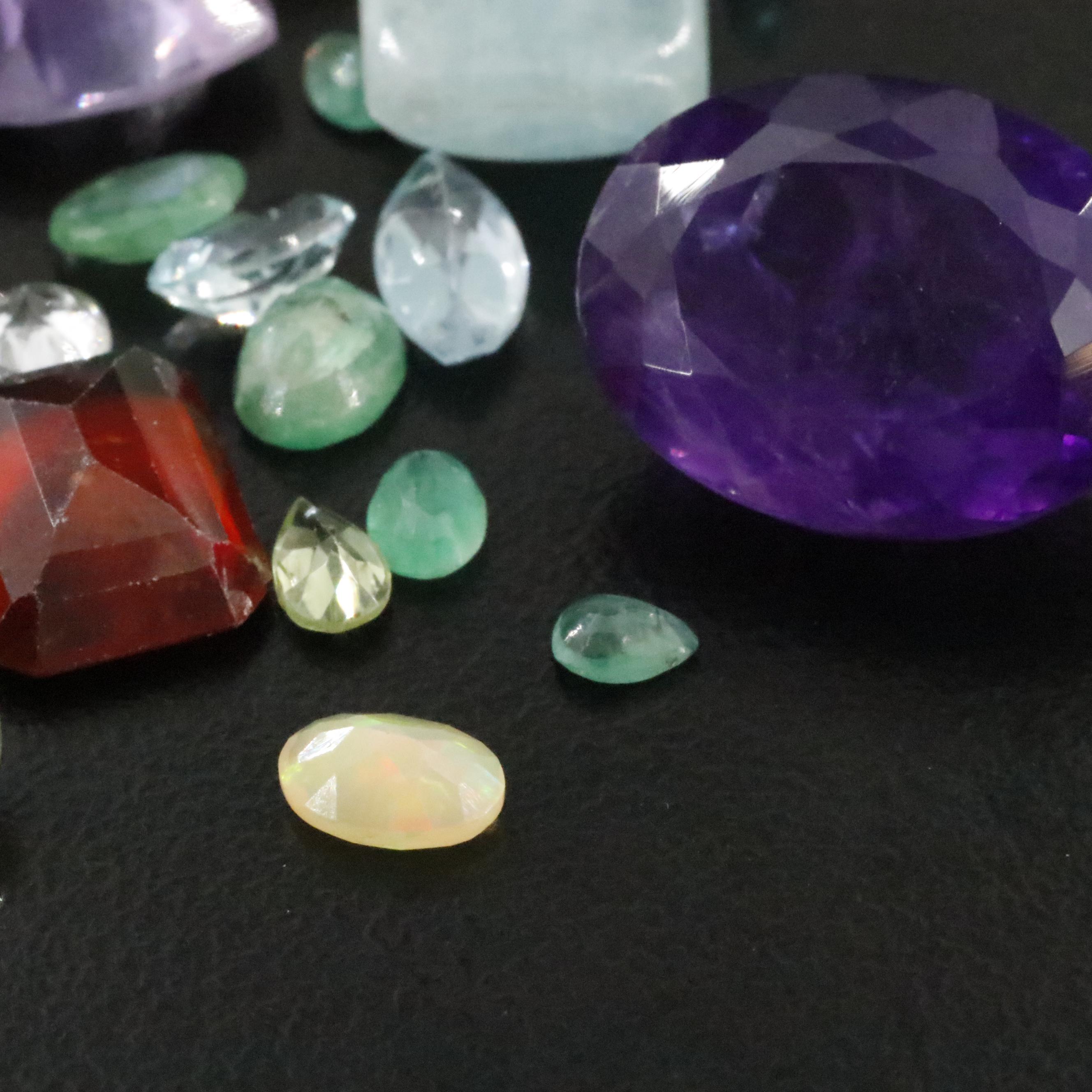 Loose 85.12 CTW Gemstones Including Amethyst, Citrine and Garnet