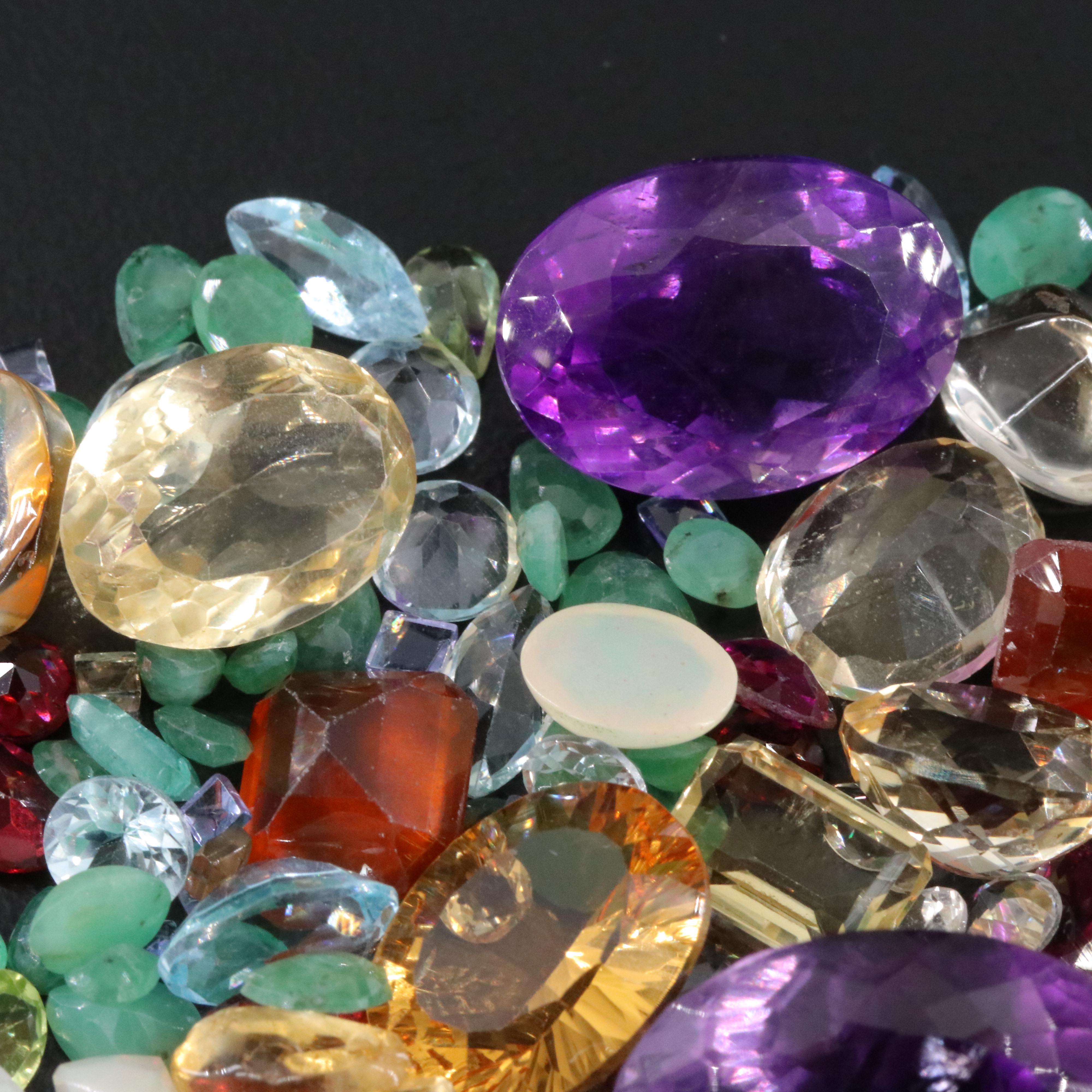 Loose 91.14 CTW Gemstone Lot Including Rainbow Moonstone, Emerald and Amethyst