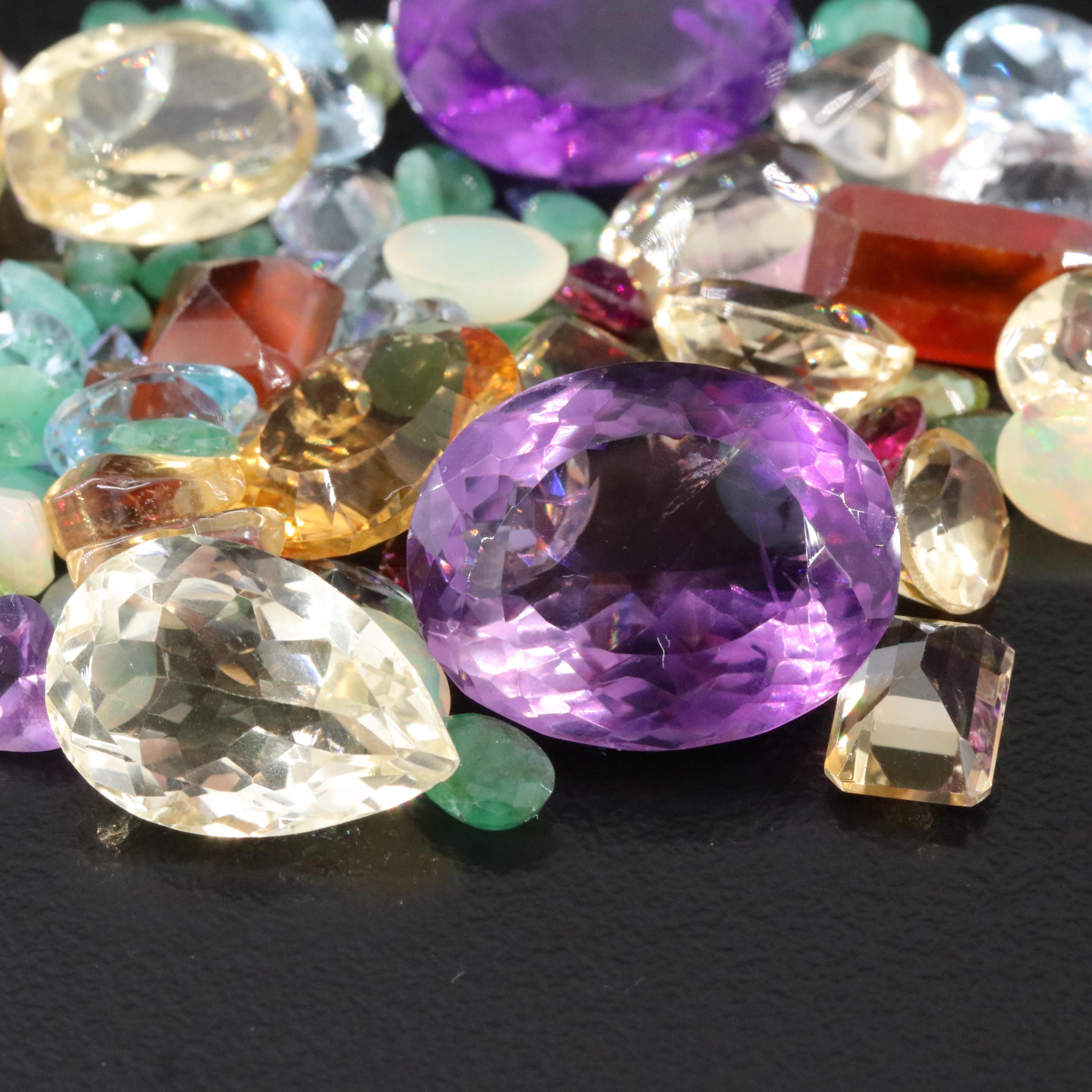 Loose 91.14 CTW Gemstone Lot Including Rainbow Moonstone, Emerald and Amethyst