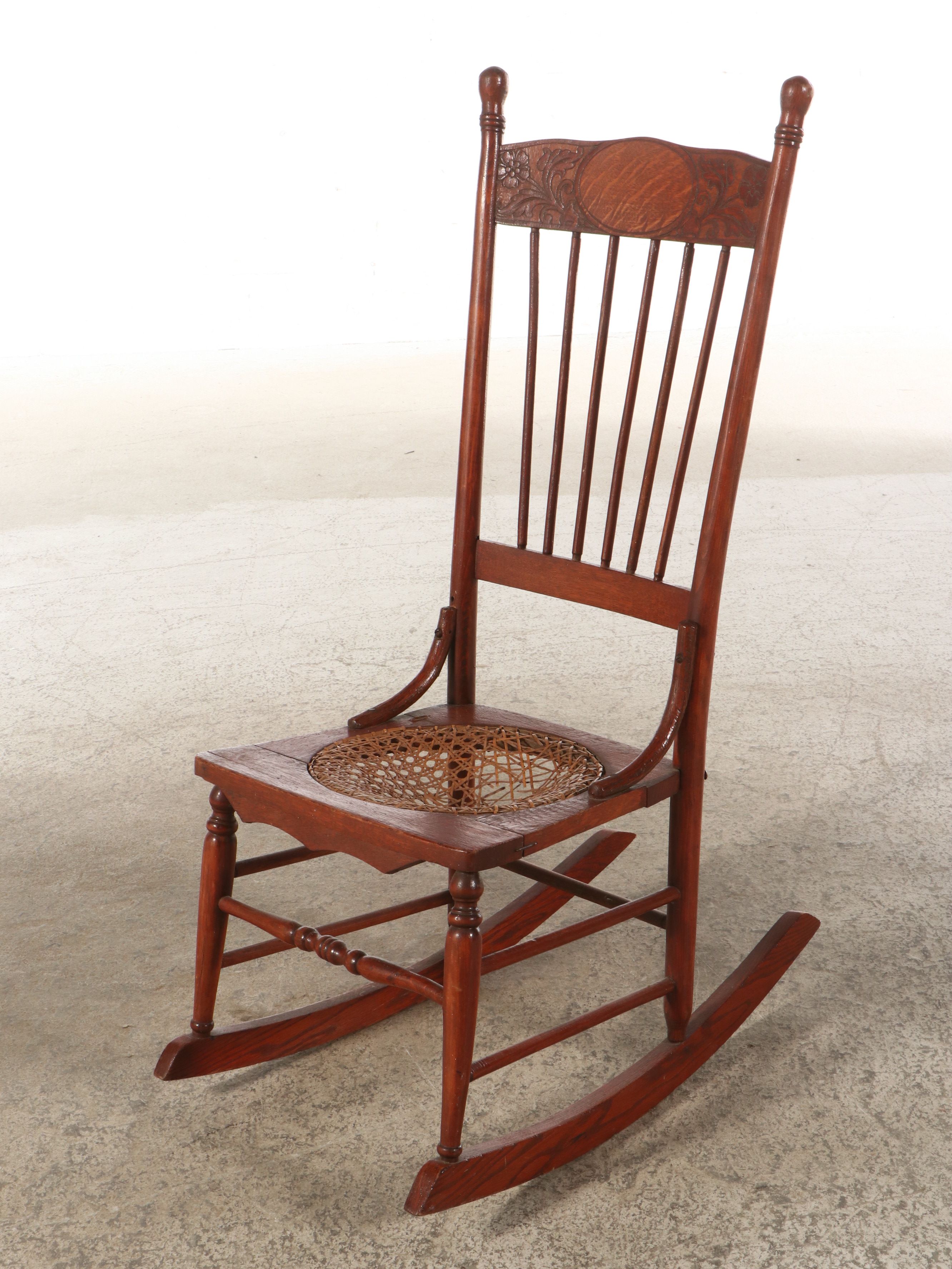 Late Victorian Carved Oak Rocking Chair with Cane Bottom Seat