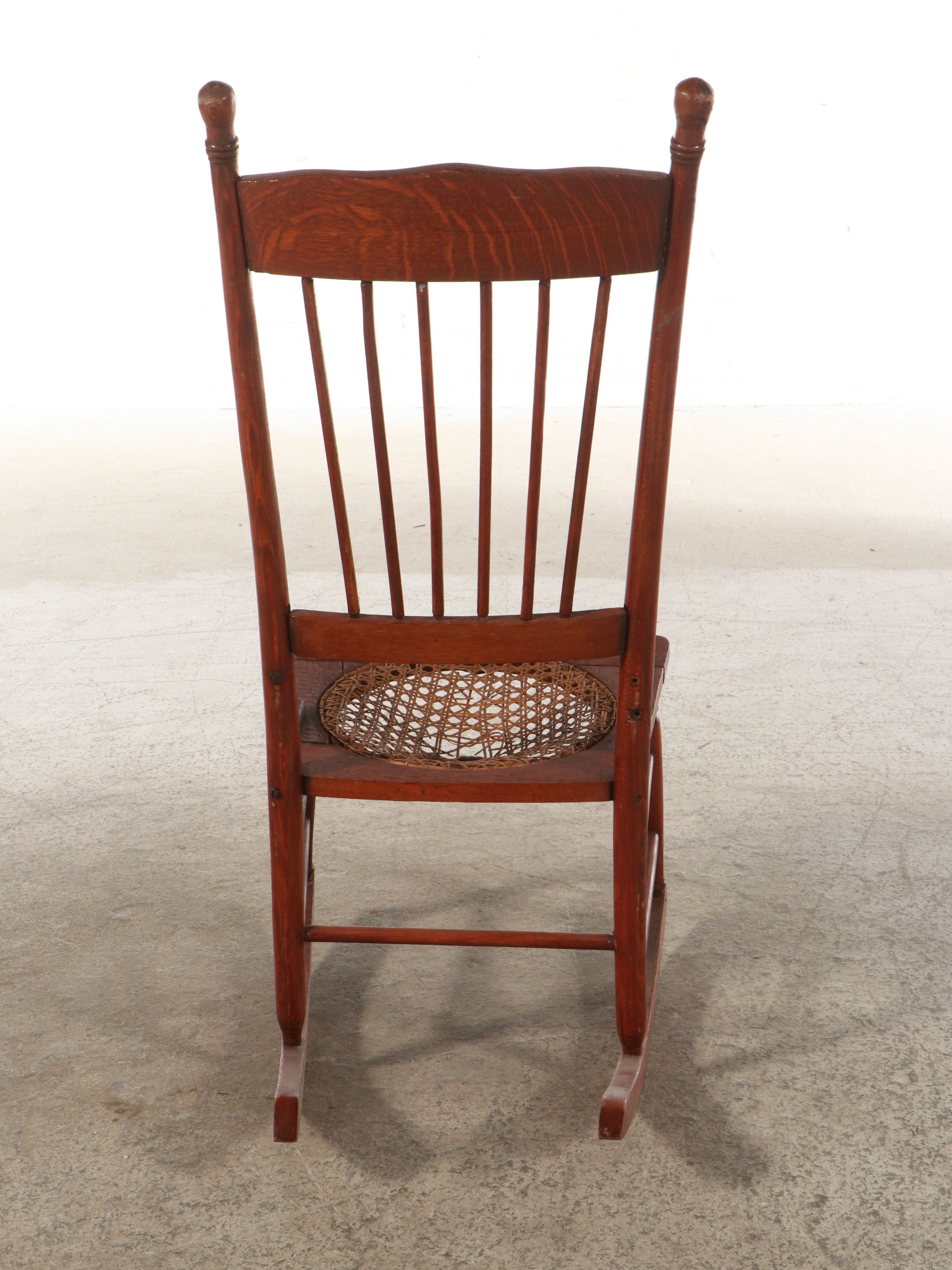 Late Victorian Carved Oak Rocking Chair with Cane Bottom Seat