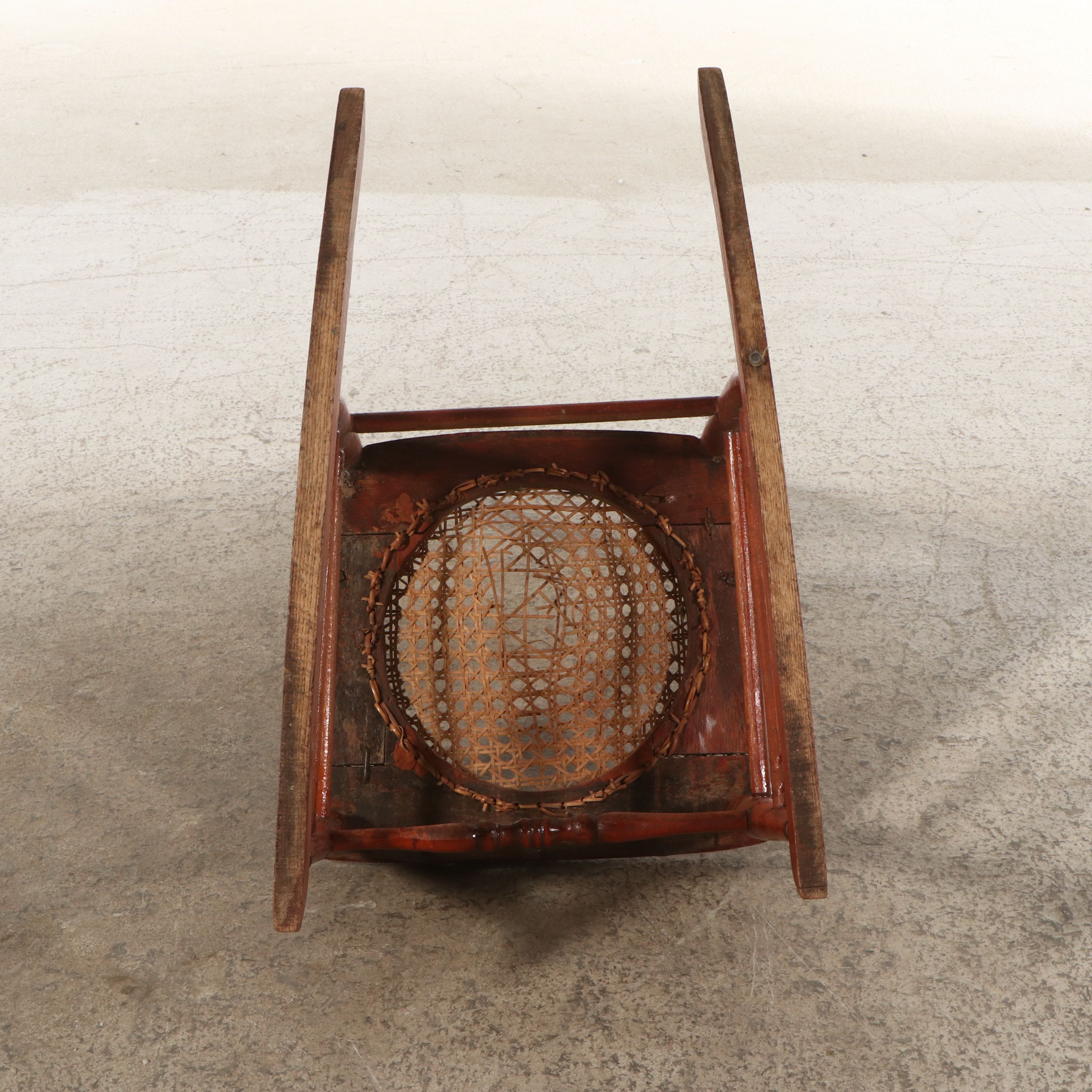 Late Victorian Carved Oak Rocking Chair with Cane Bottom Seat