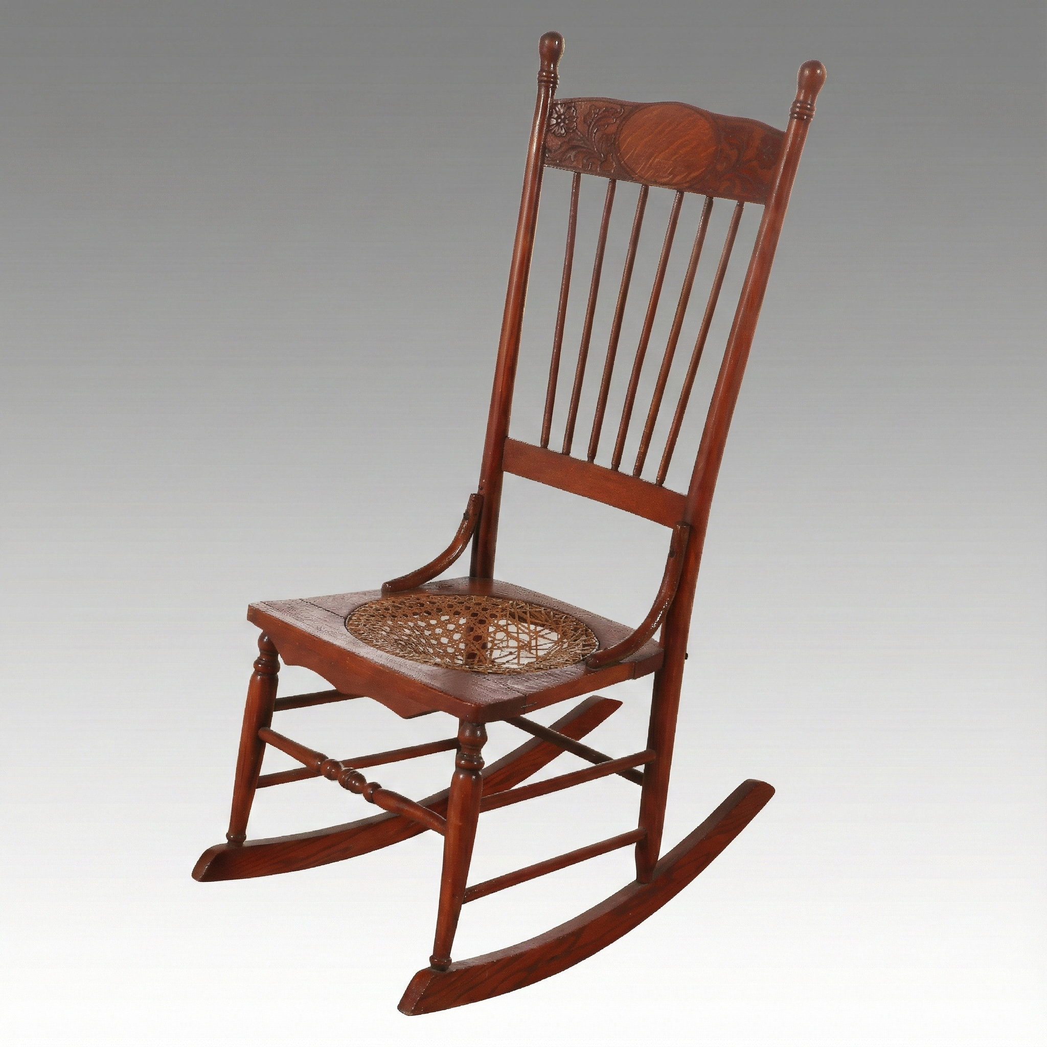 Late Victorian Carved Oak Rocking Chair with Cane Bottom Seat