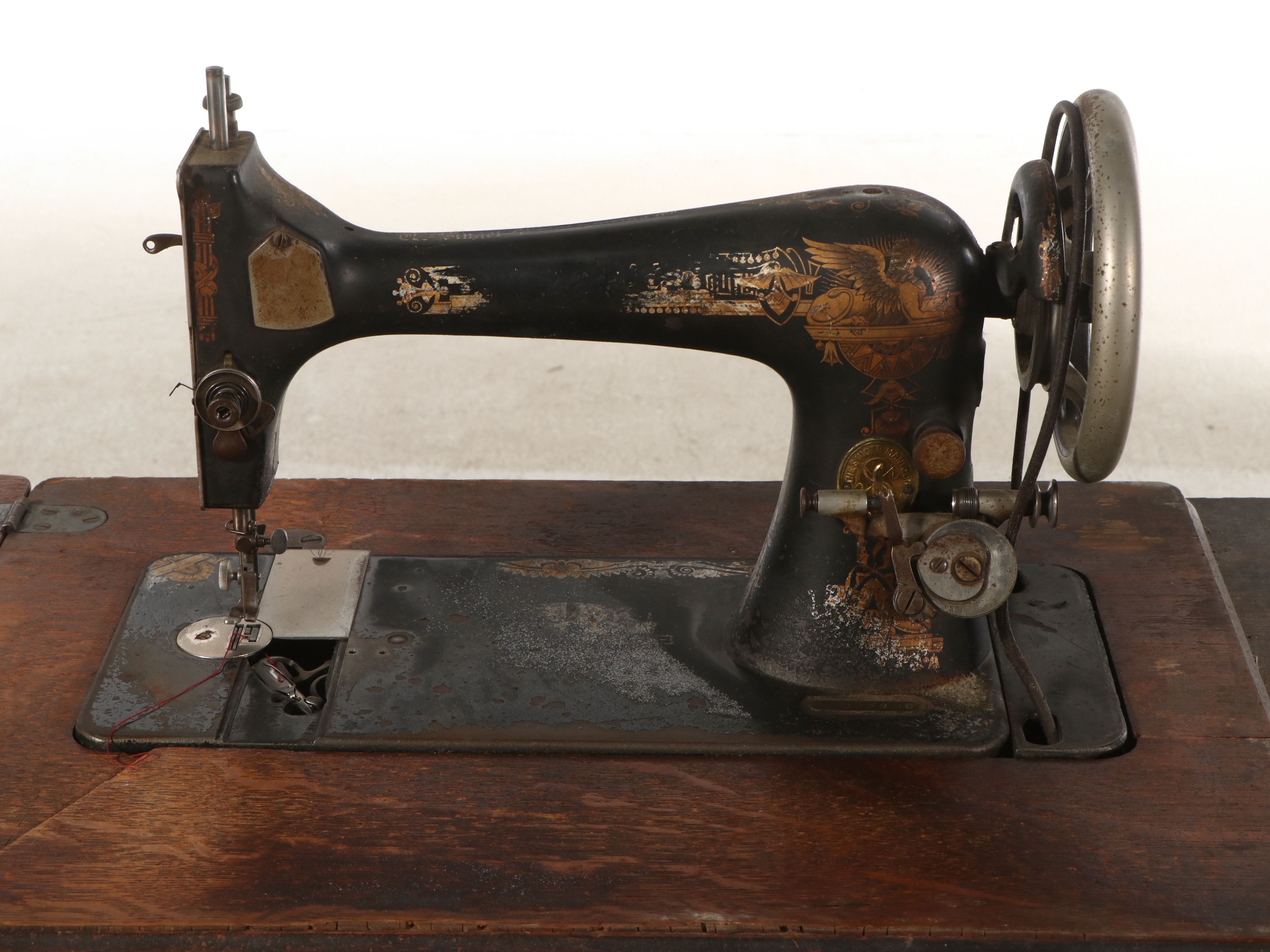 Singer Model 27 Sewing Machine with Oak Five-Drawer Treadle Table, c. 1909