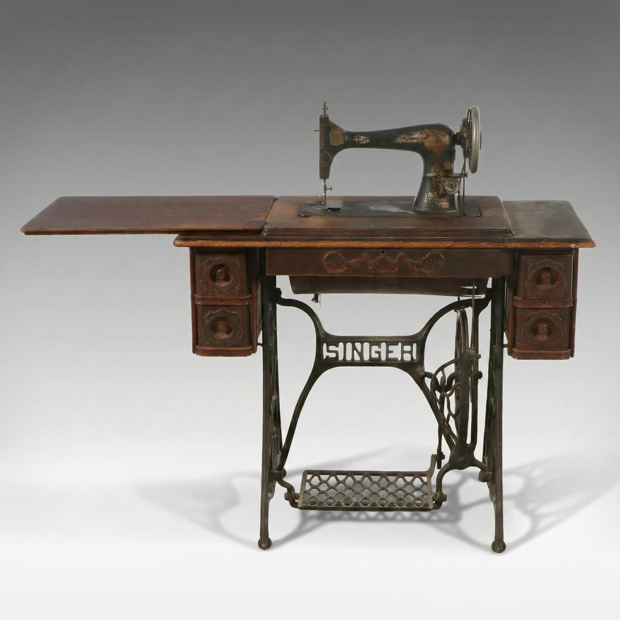 Singer Model 27 Sewing Machine with Oak Five-Drawer Treadle Table, c. 1909