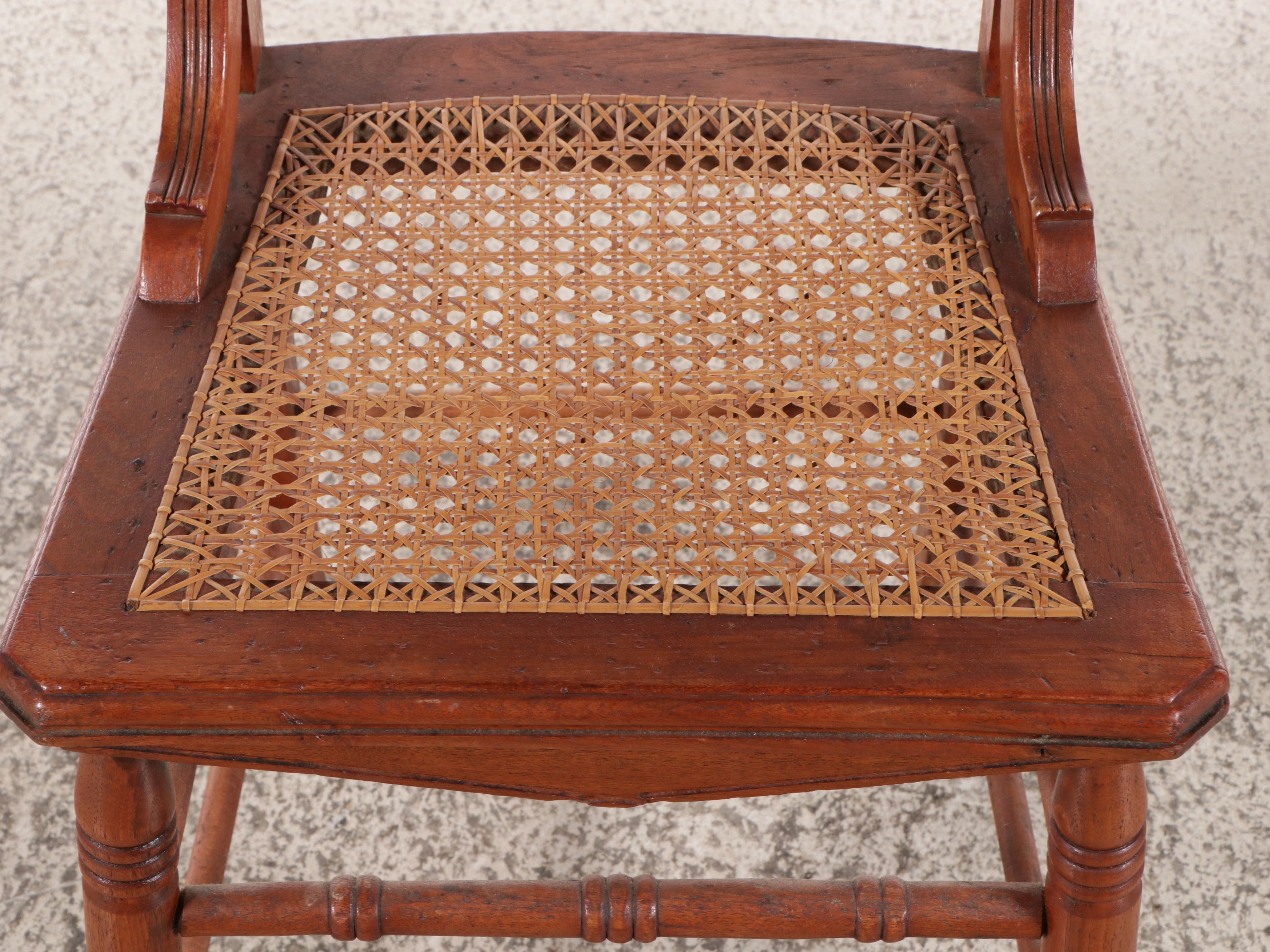 Set of Six Eastlake Style Incised Walnut Chairs with Cane Seats