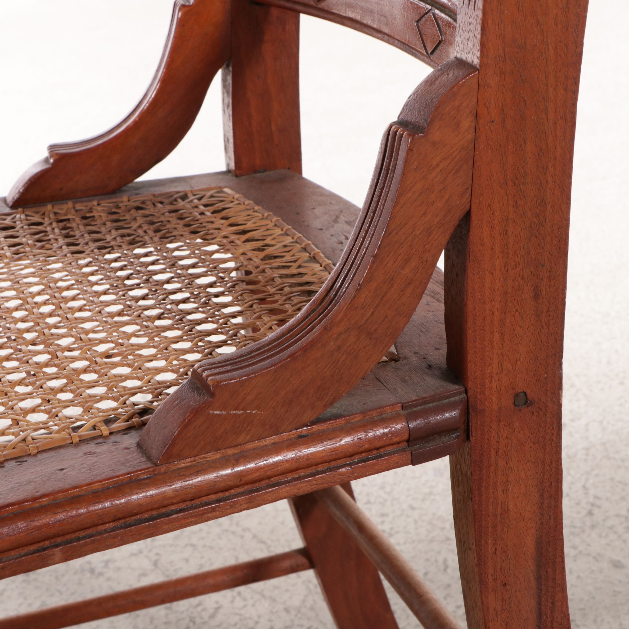 Set of Six Eastlake Style Incised Walnut Chairs with Cane Seats