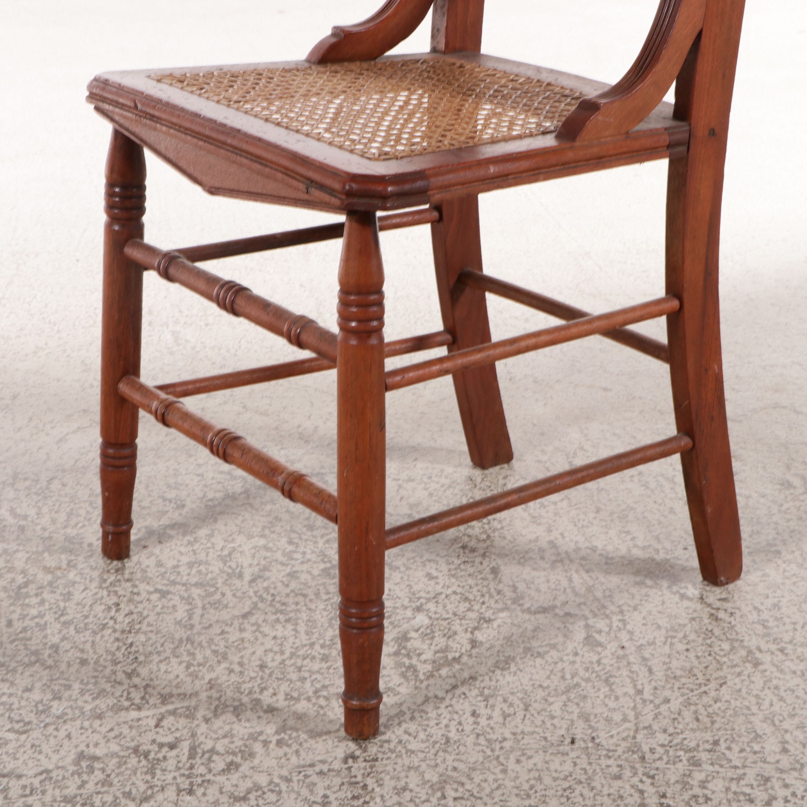 Set of Six Eastlake Style Incised Walnut Chairs with Cane Seats