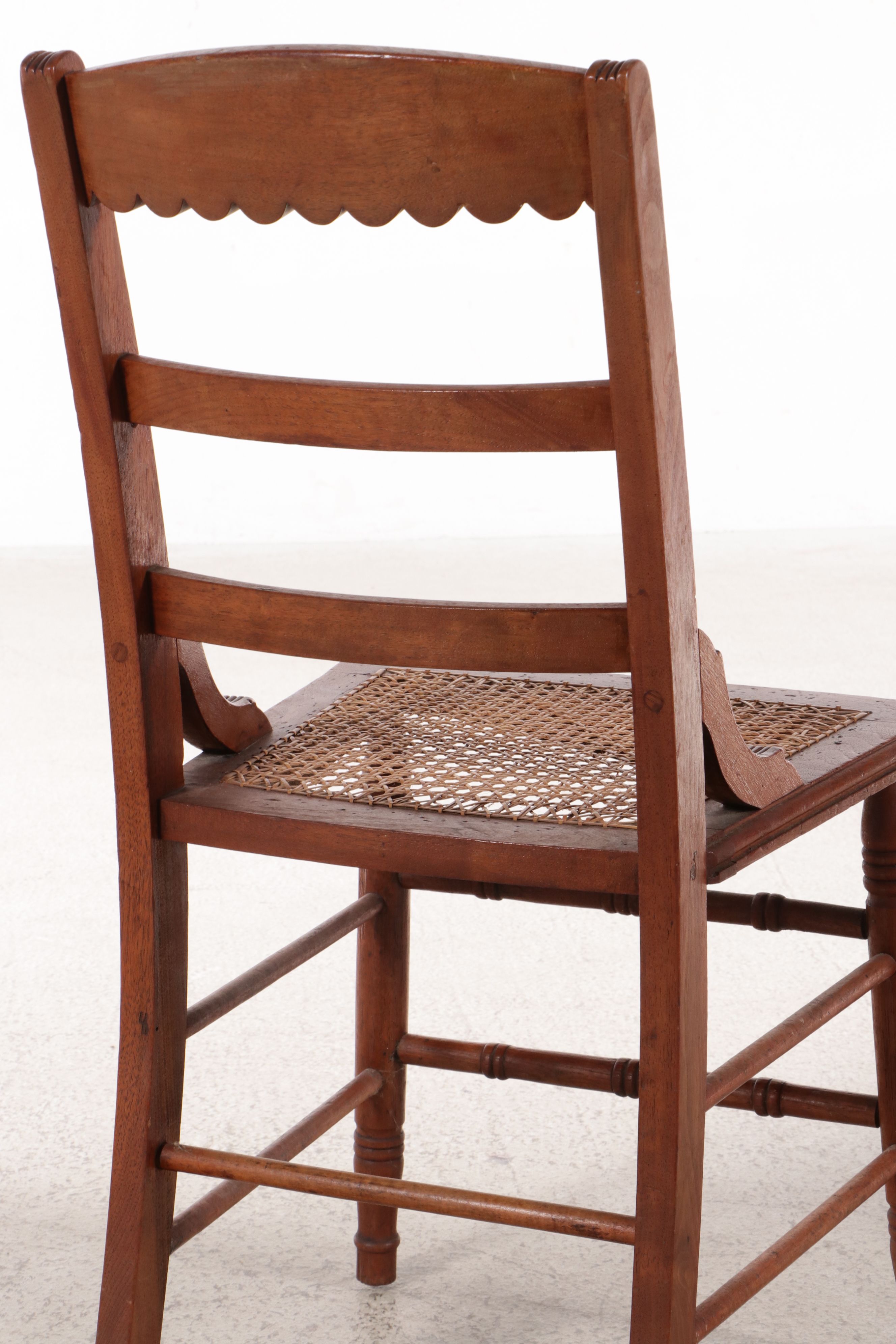 Set of Six Eastlake Style Incised Walnut Chairs with Cane Seats
