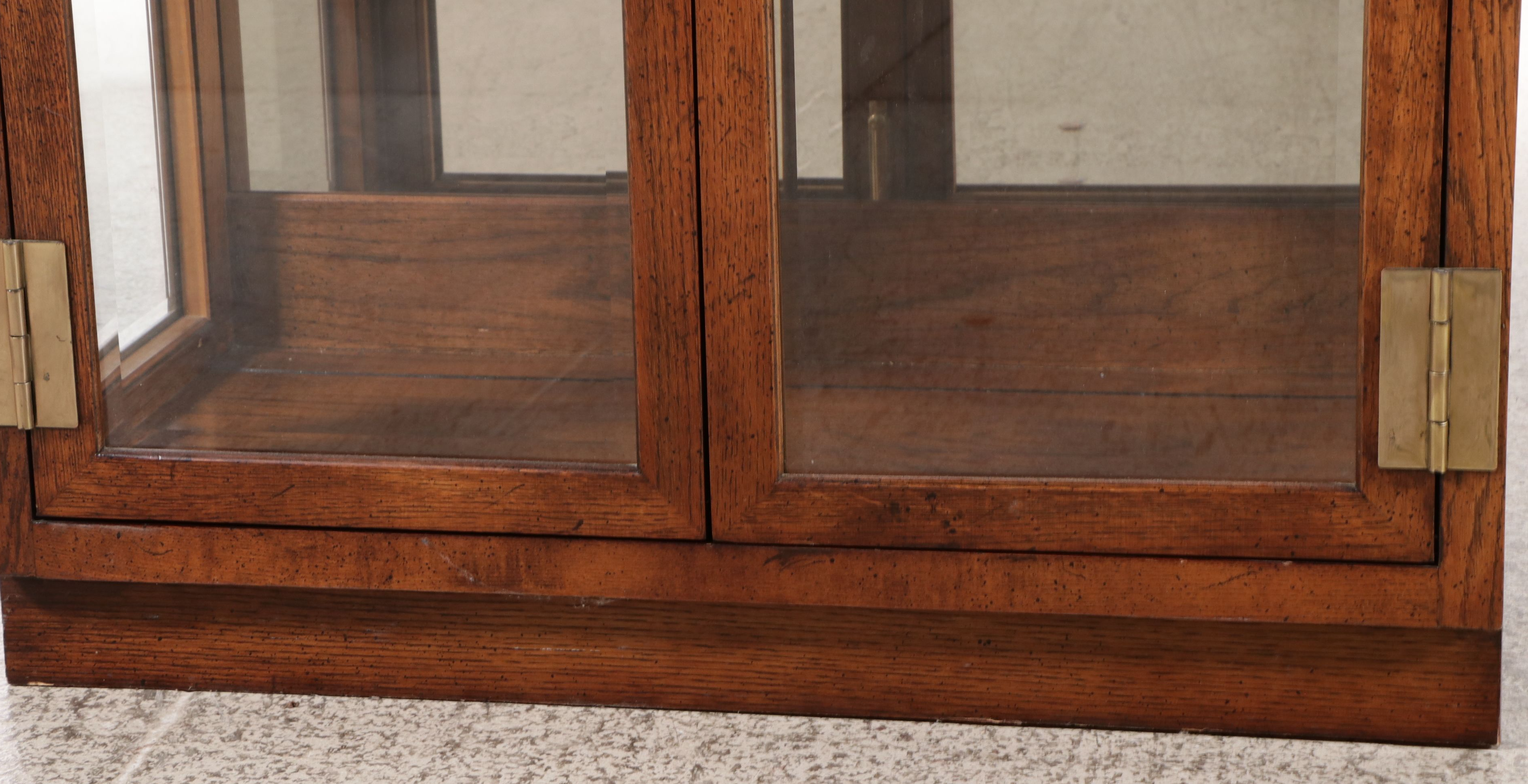 Henredon Oak Finish Mirrored Back Campaign Style Display Cabinets