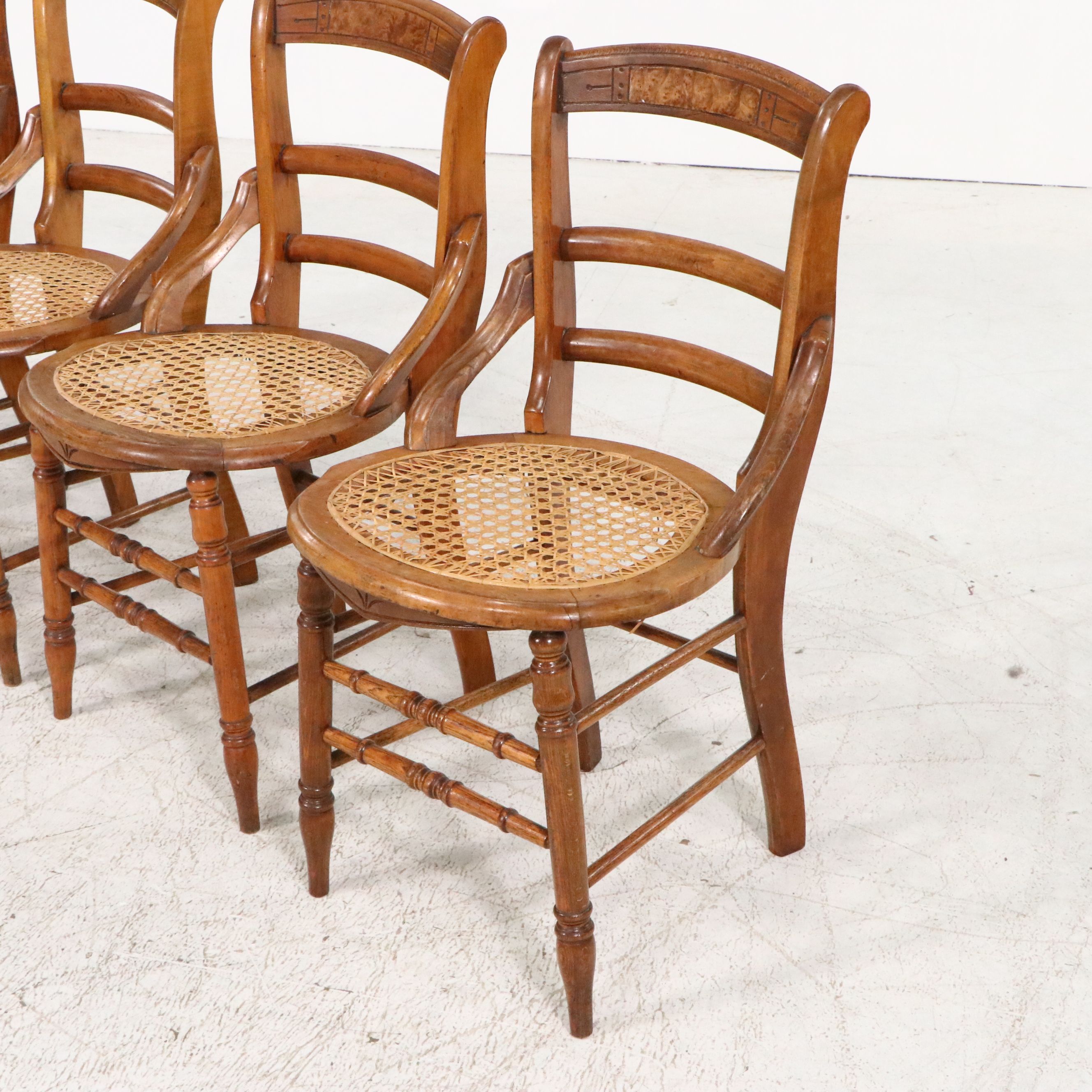 Set of Four Eastlake Style Birdseye Maple Accented Cane Bottom Chairs