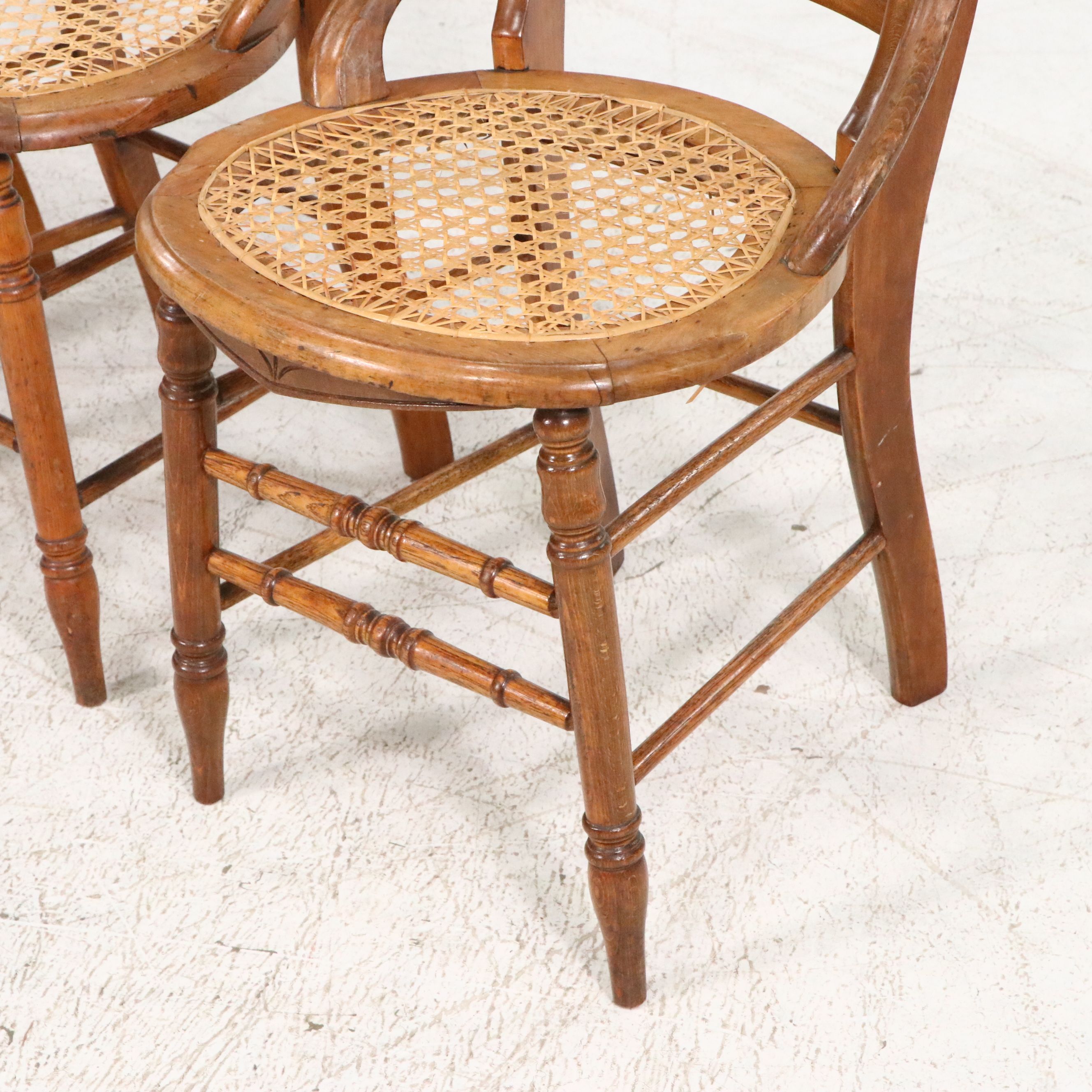 Set of Four Eastlake Style Birdseye Maple Accented Cane Bottom Chairs