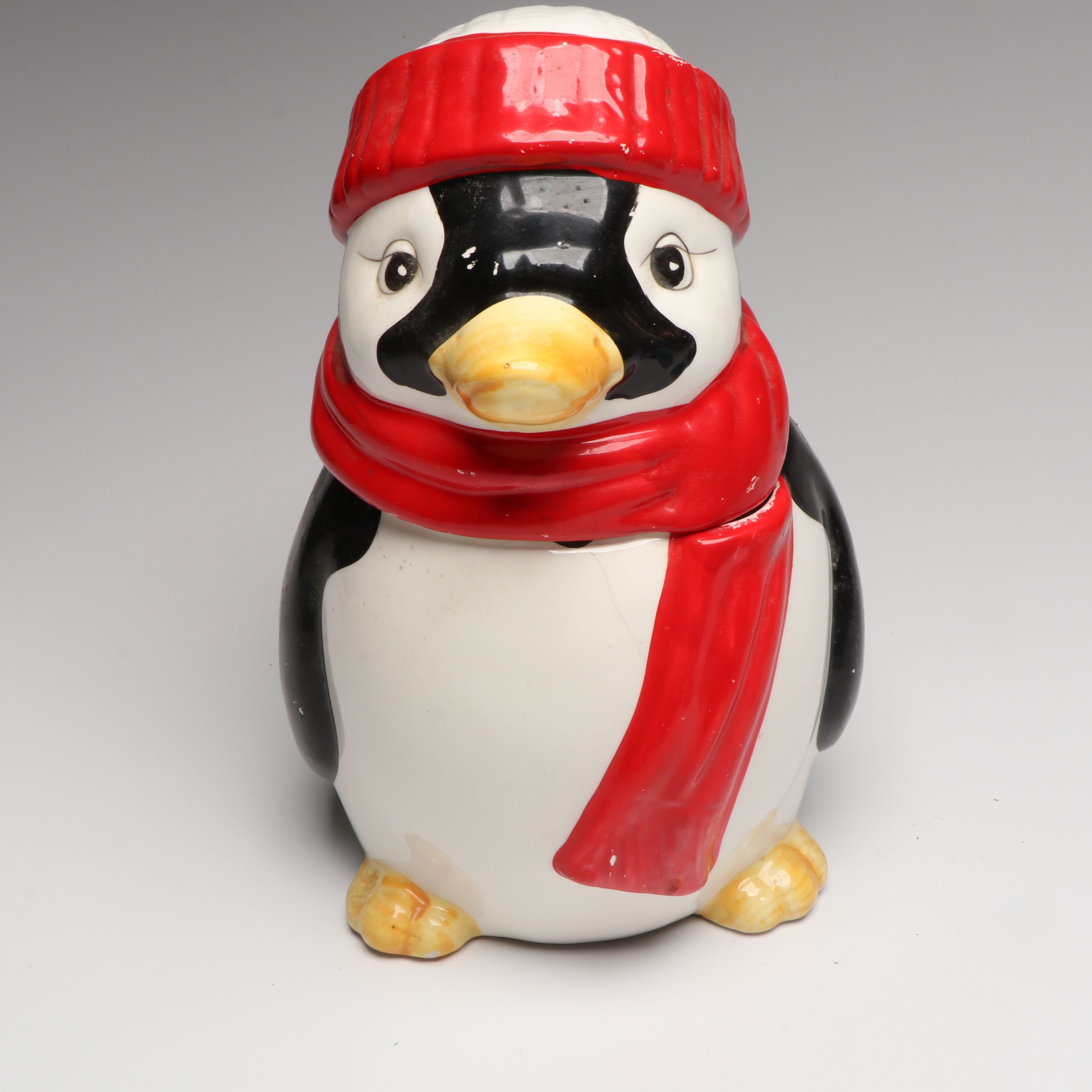 Penguin Figural Ceramic Cookie Jar with Other Penguin Canisters and Figures