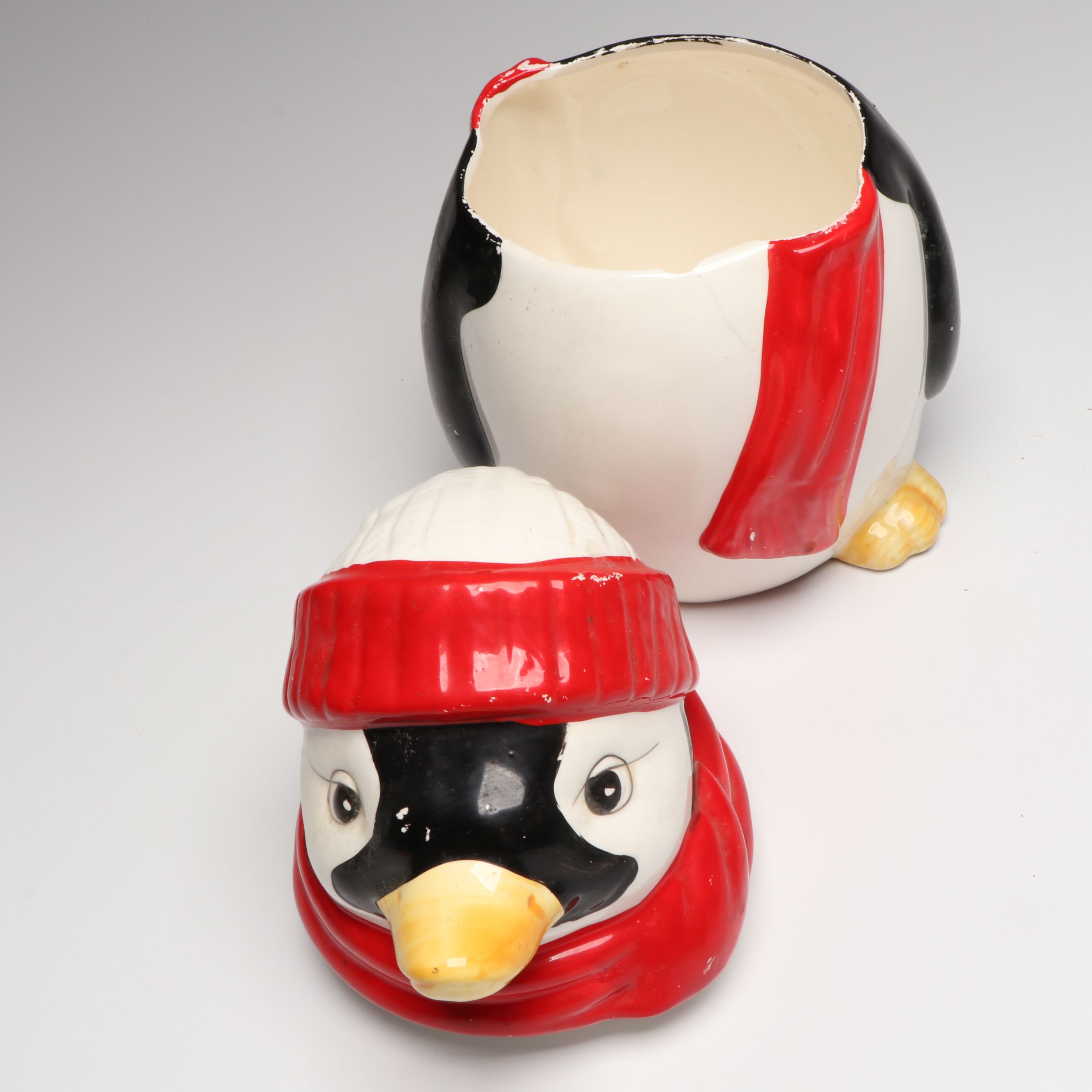 Penguin Figural Ceramic Cookie Jar with Other Penguin Canisters and Figures