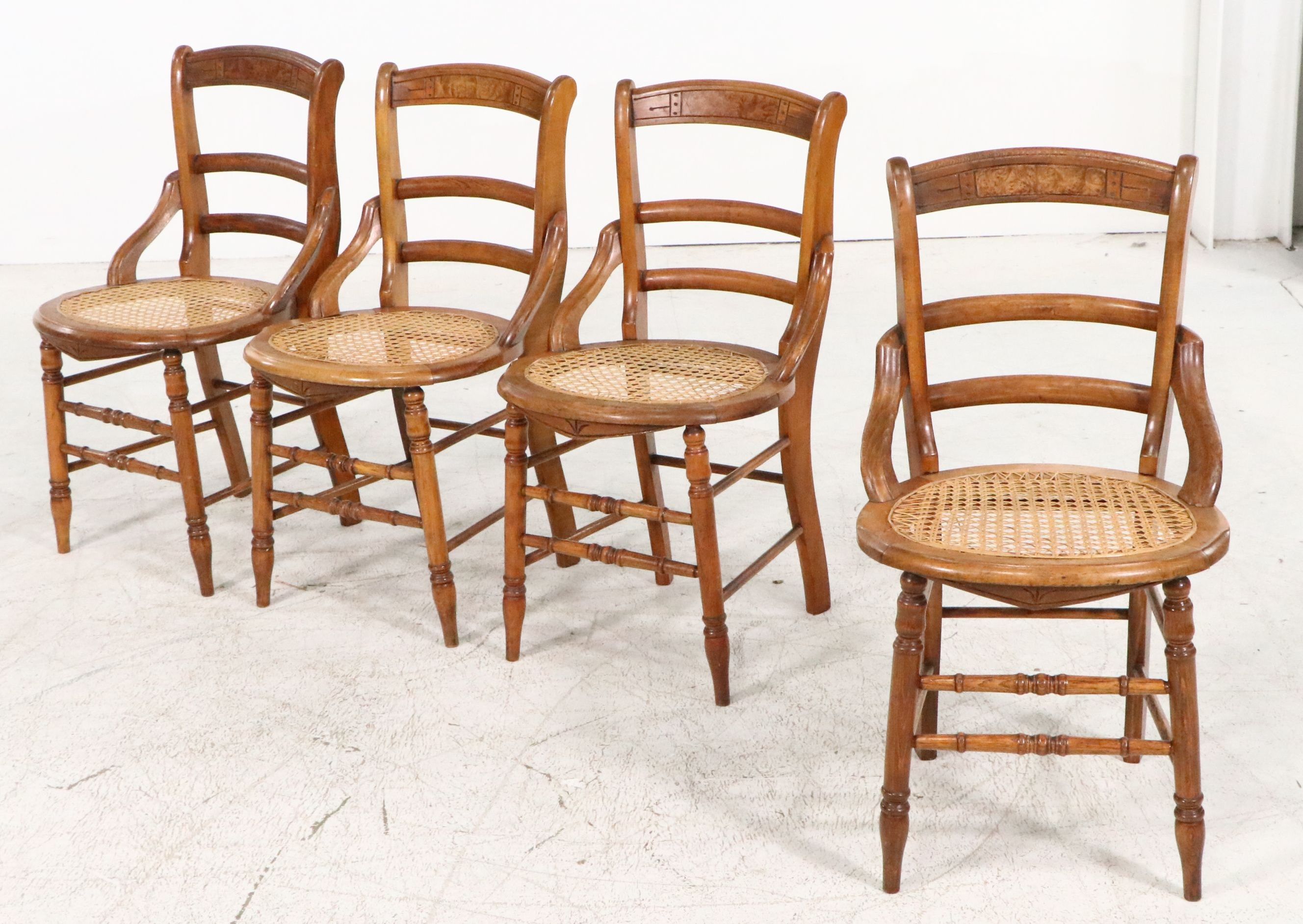 Set of Four Eastlake Style Birdseye Maple Accented Cane Bottom Chairs