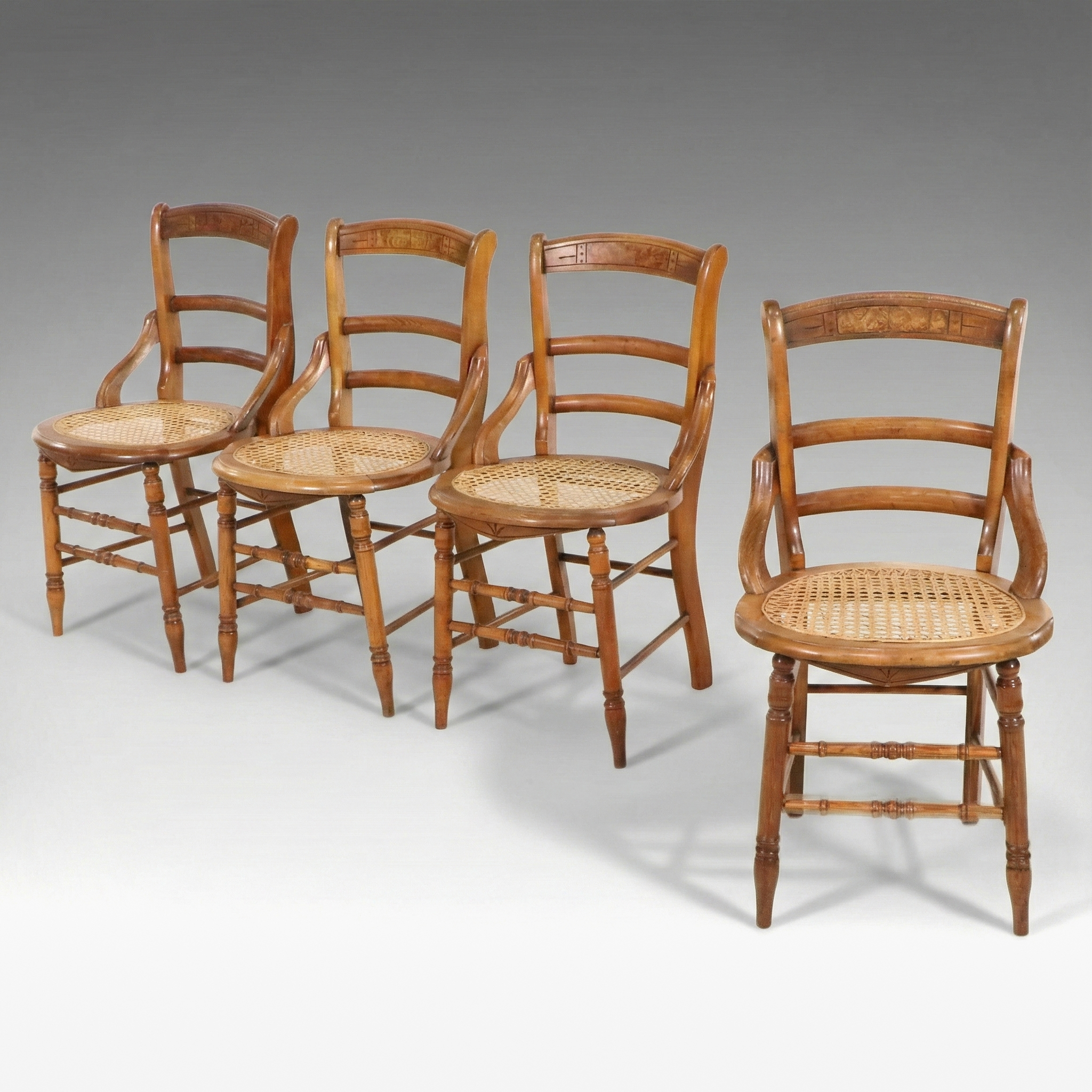 Set of Four Eastlake Style Birdseye Maple Accented Cane Bottom Chairs