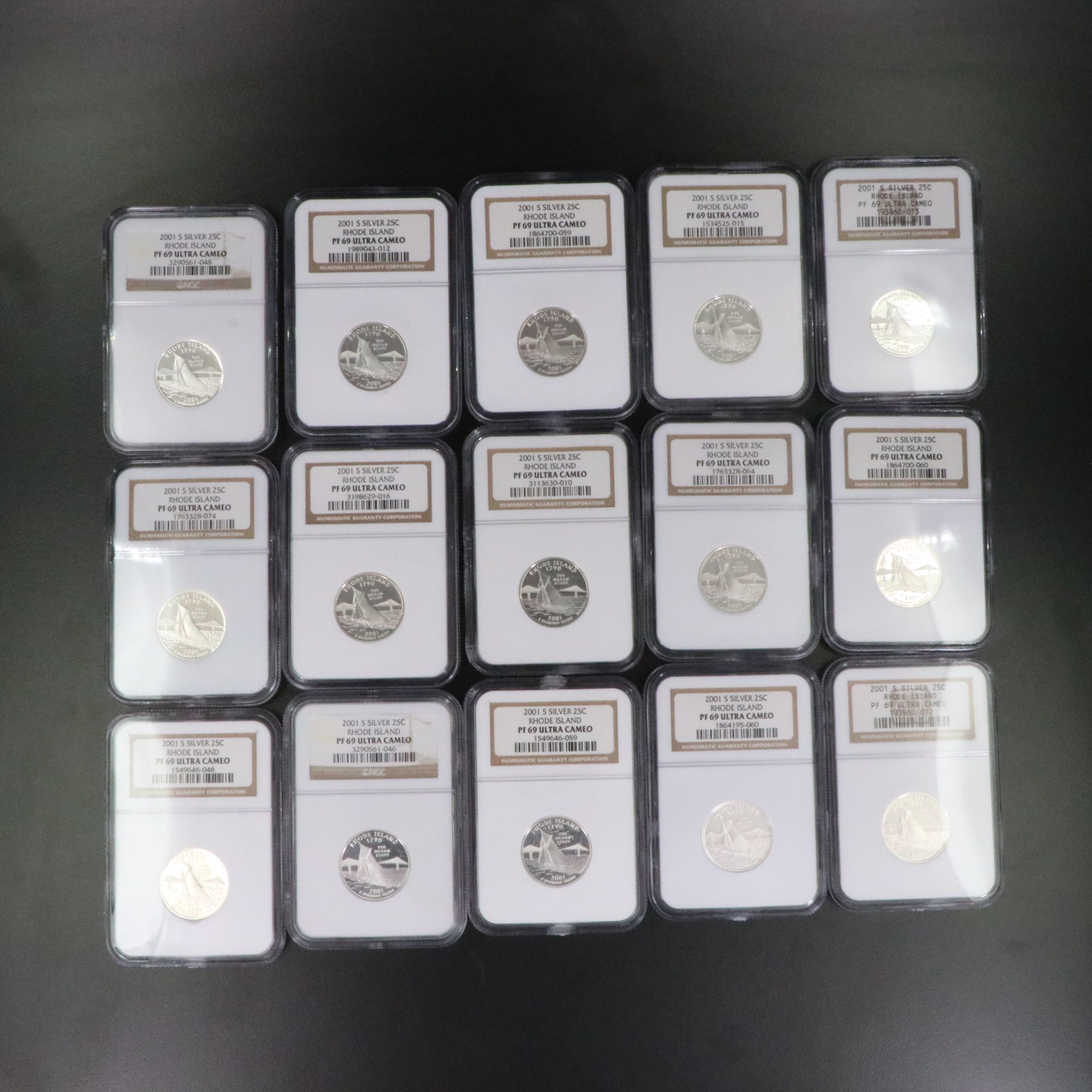 Fifteen NGC PF 69 Ultra Cameo 2001-S Rhode Island Silver State Quarters