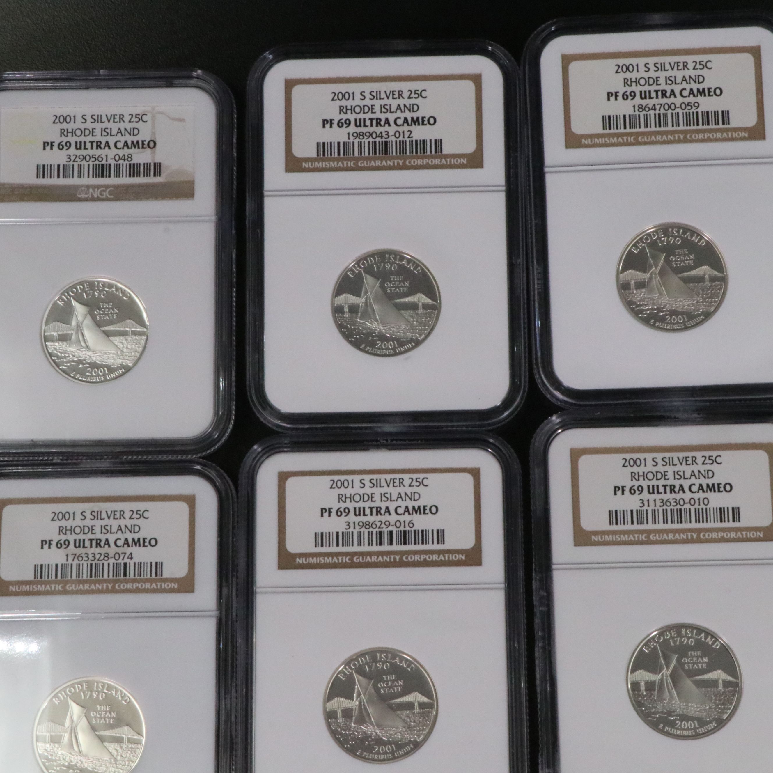 Fifteen NGC PF 69 Ultra Cameo 2001-S Rhode Island Silver State Quarters