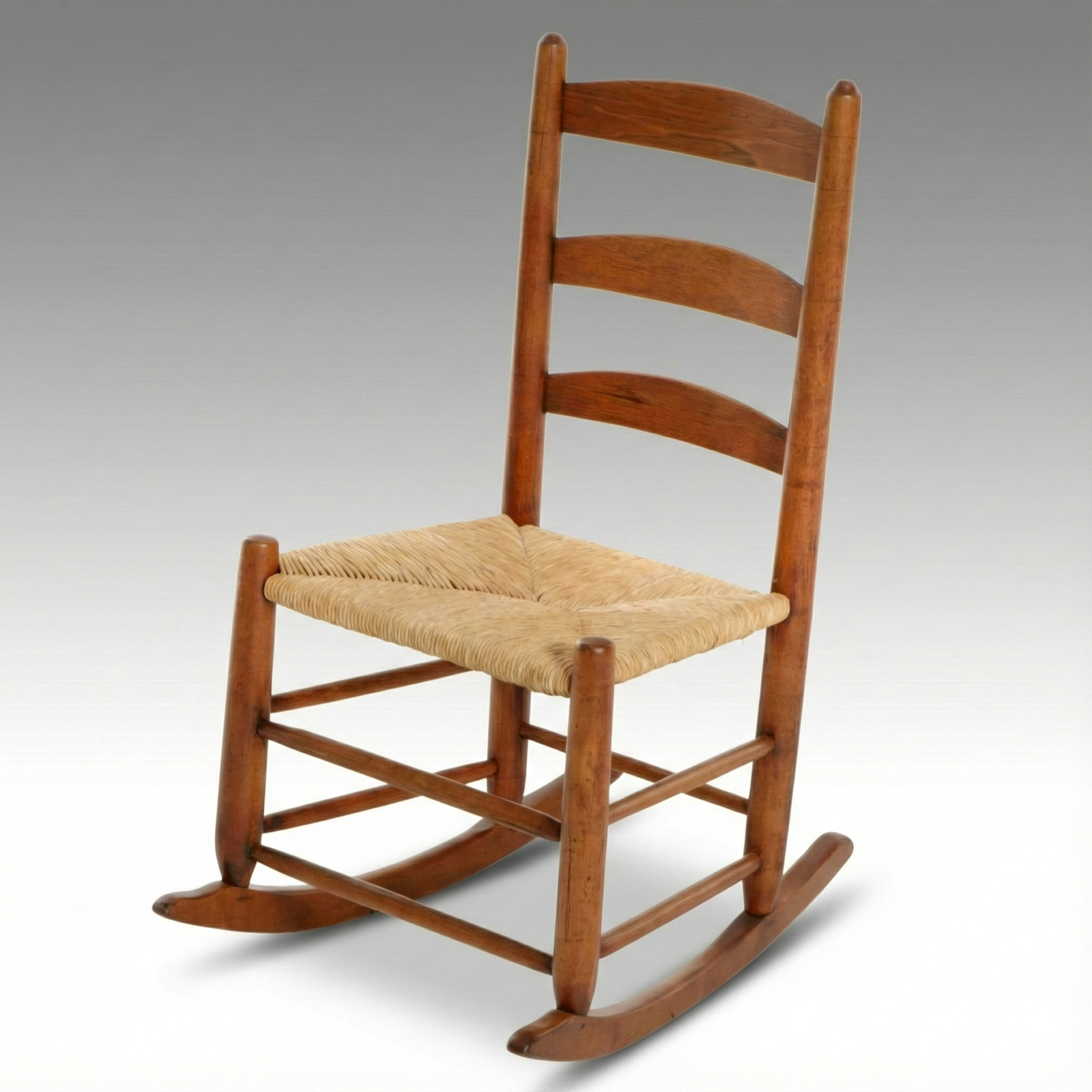 American Primitive Hardwood Ladder-Back Rocking Chair with Rush Seat