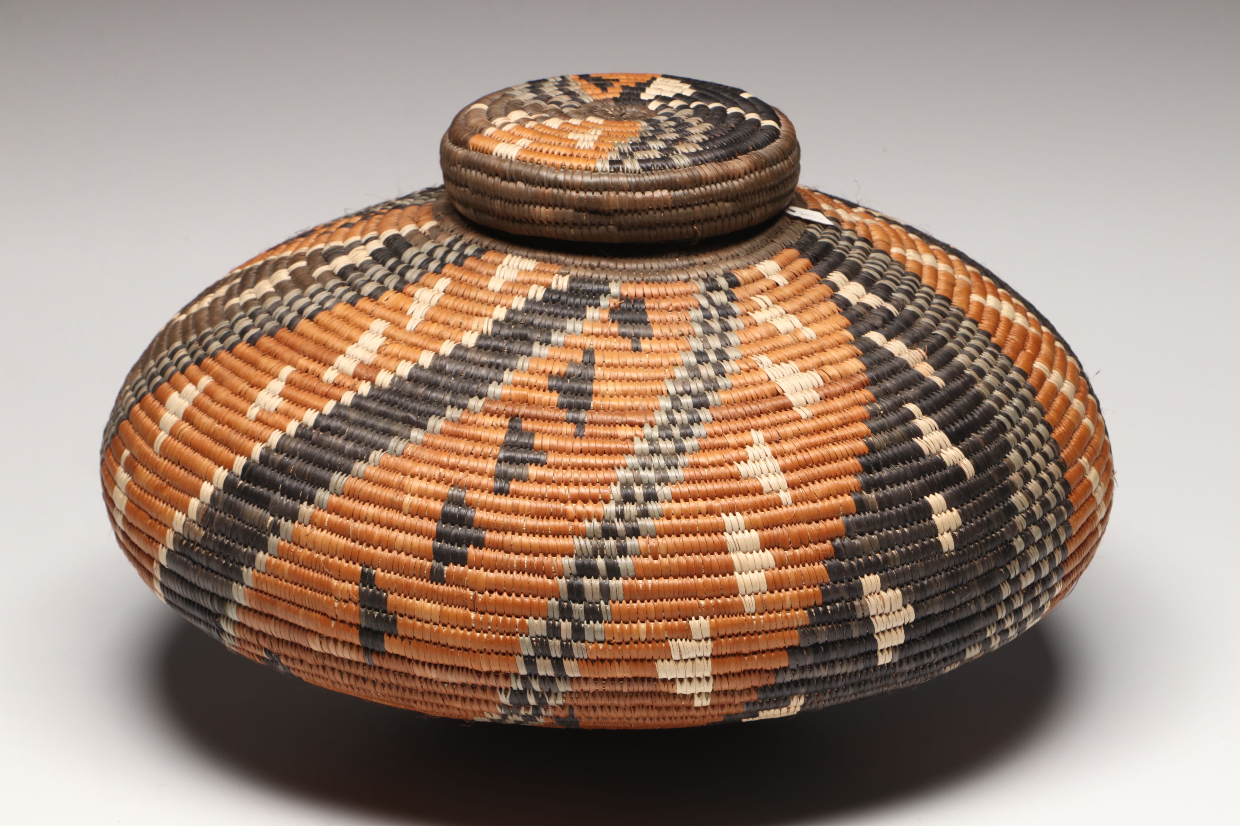 Hlenglwo Ptiuli with Other Zulu Ilala Palm Basketry and Herb Container