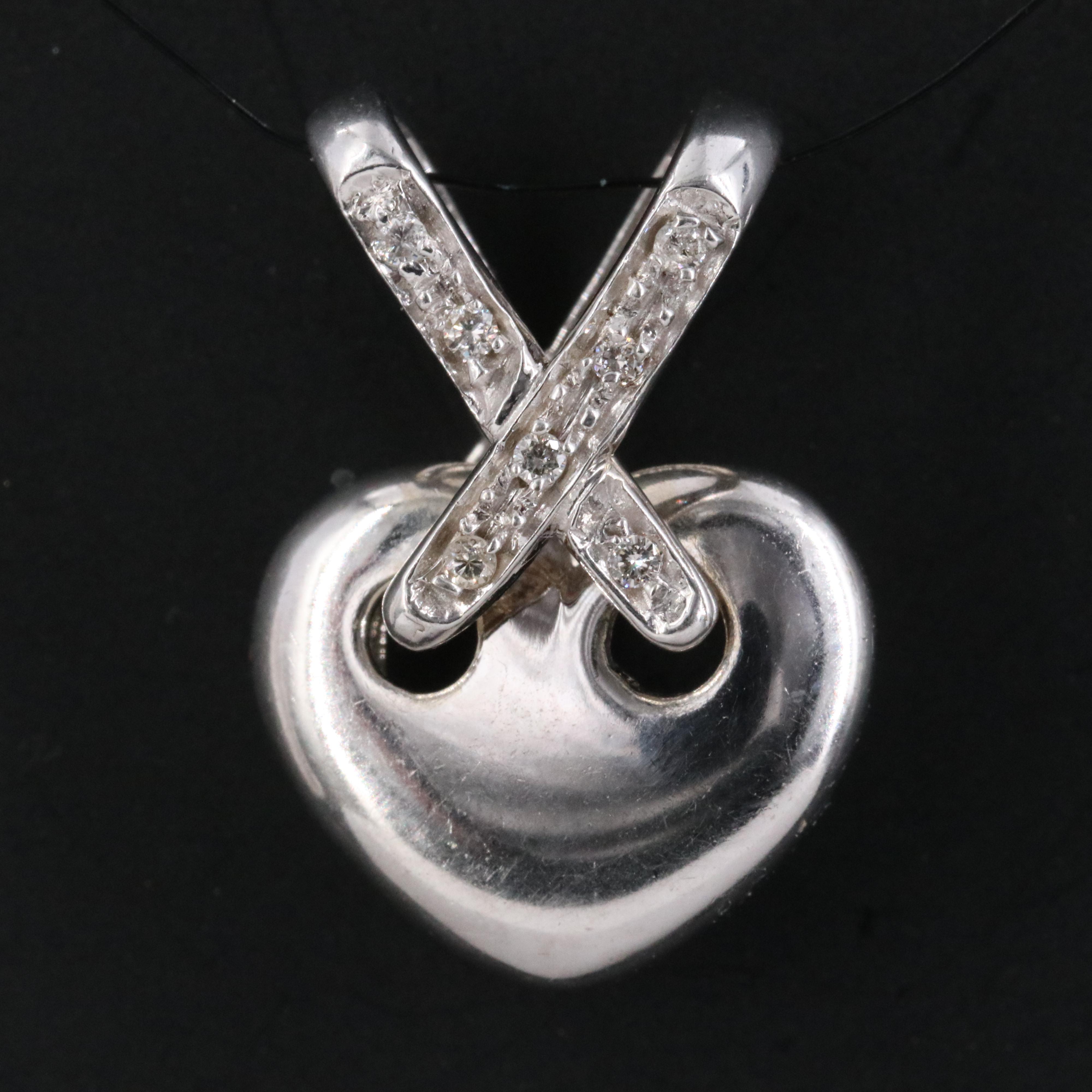 14K 0.05 CTW Diamond Heart Criss Cross Pendant
