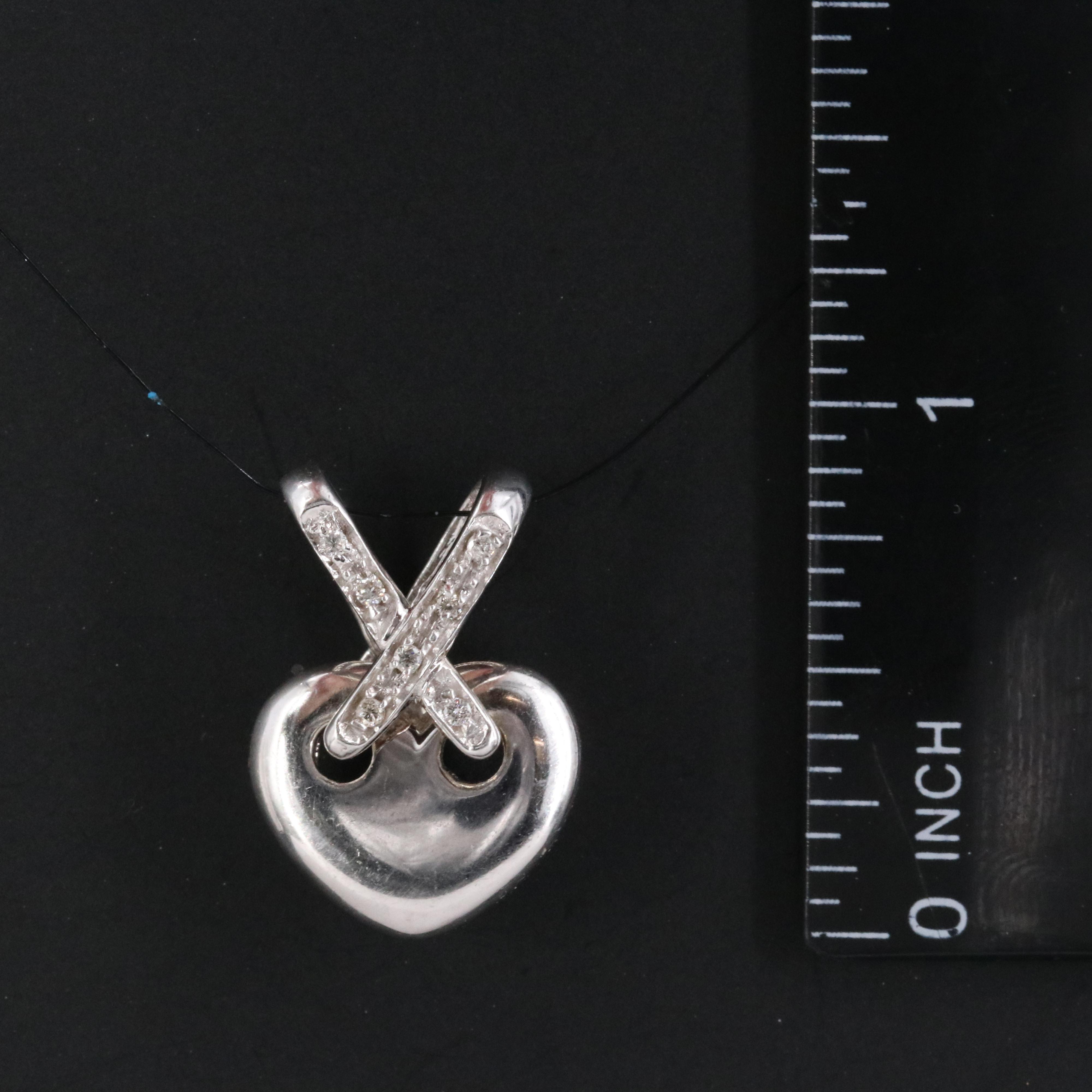 14K 0.05 CTW Diamond Heart Criss Cross Pendant