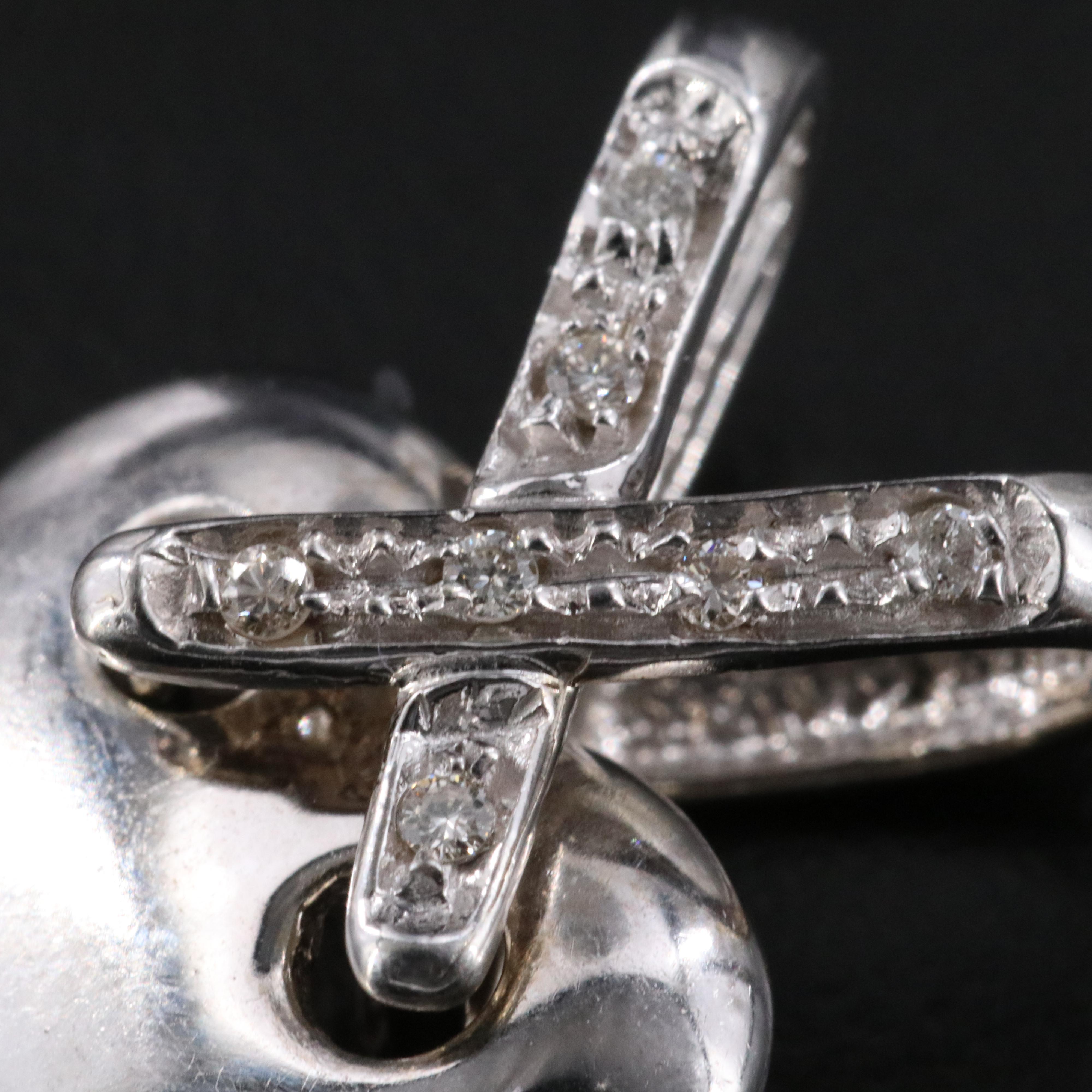 14K 0.05 CTW Diamond Heart Criss Cross Pendant