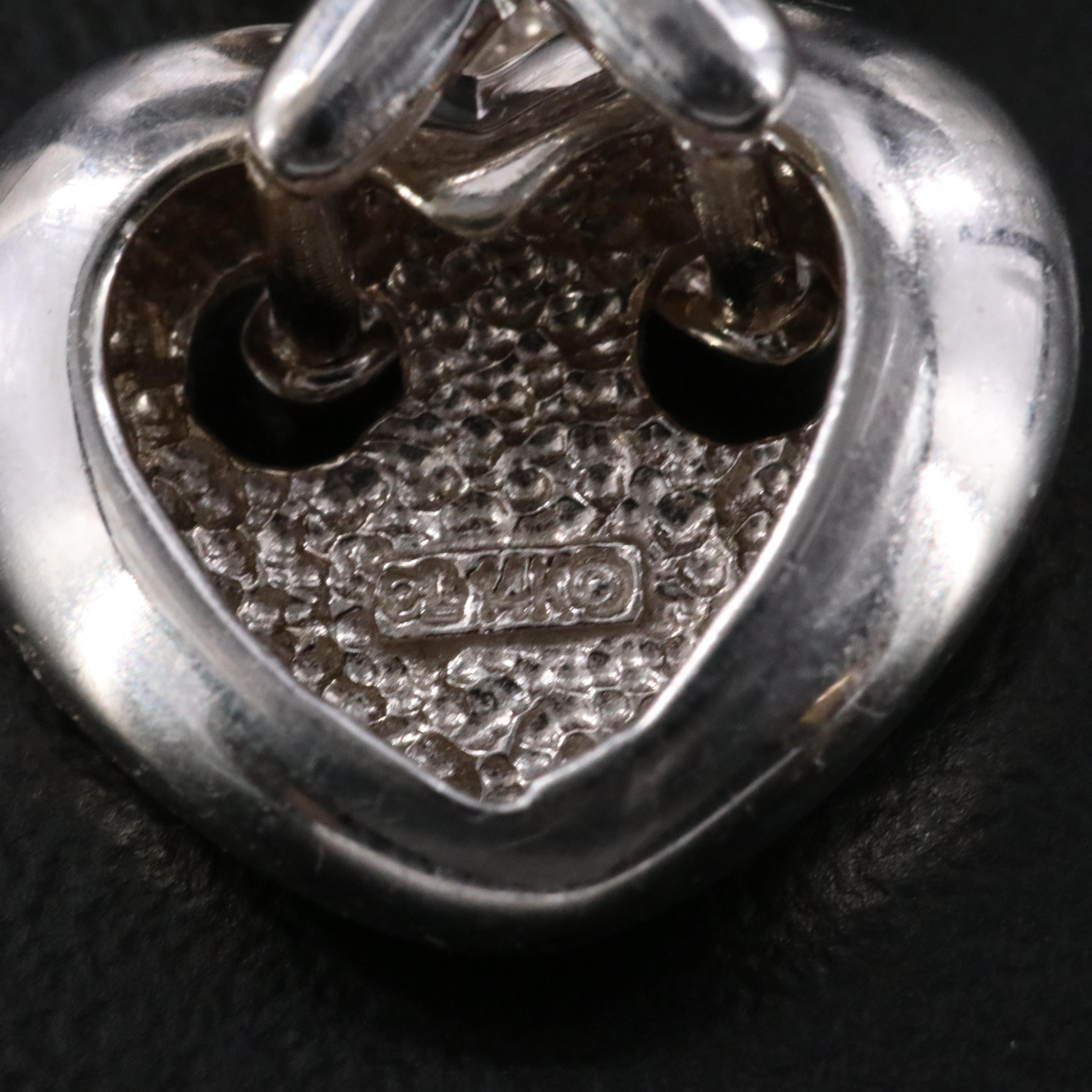 14K 0.05 CTW Diamond Heart Criss Cross Pendant