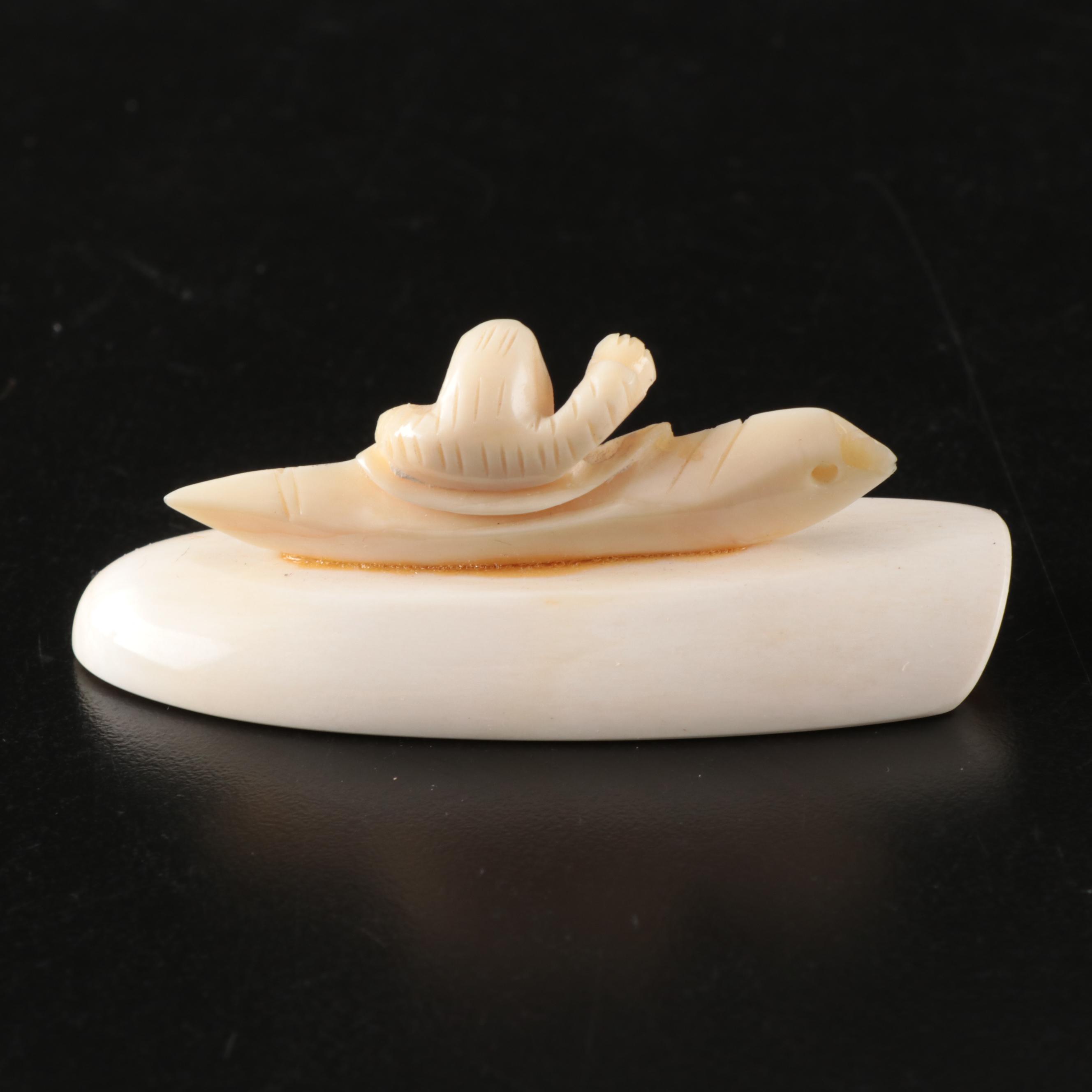 Inuit and Arctic Indigenous Carved Walrus Ivory Hunter in Kayak and Animals