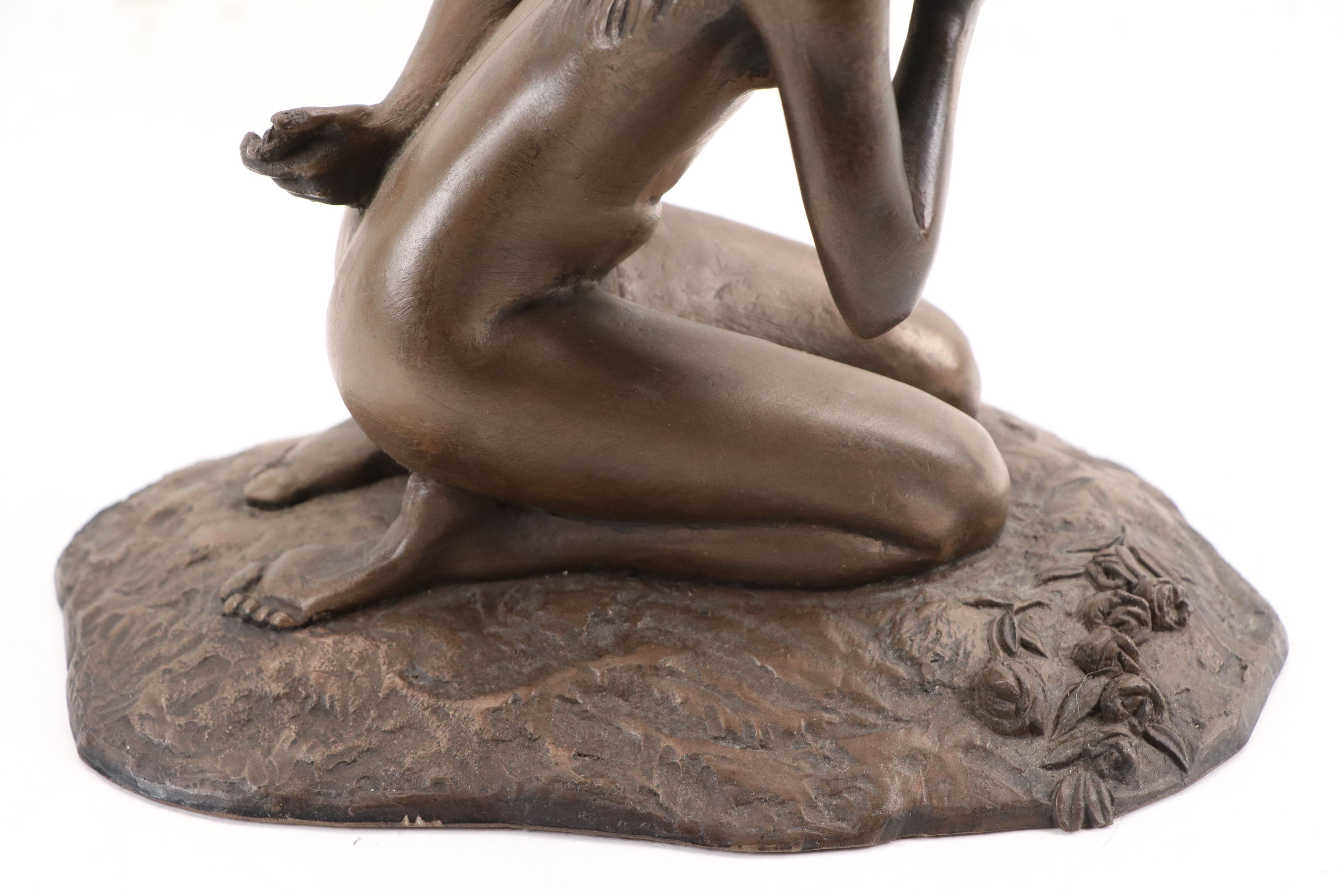 M. Stelzer Cast Spelter Sculpture of Kneeling Figure with Flowers