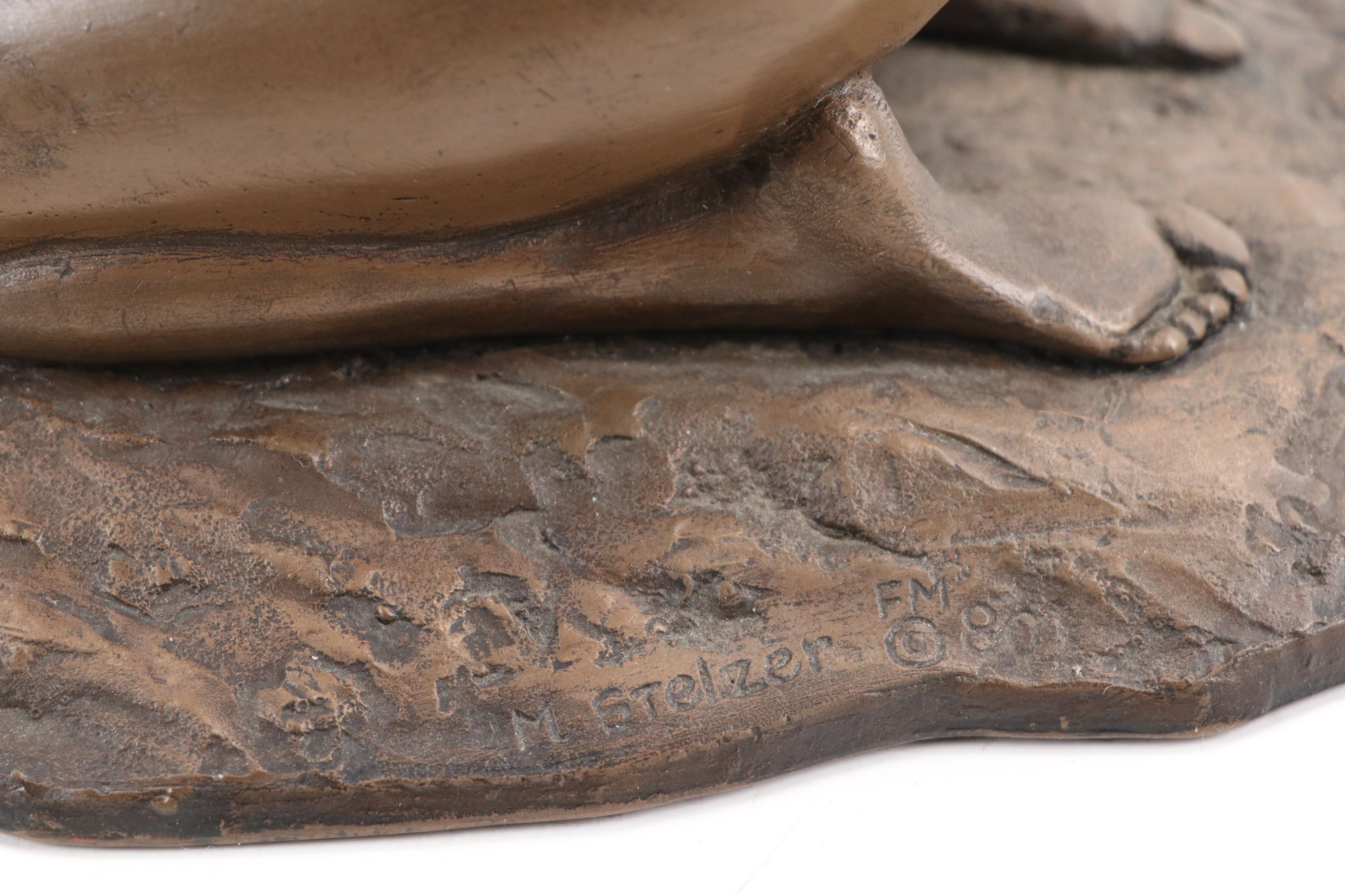 M. Stelzer Cast Spelter Sculpture of Kneeling Figure with Flowers