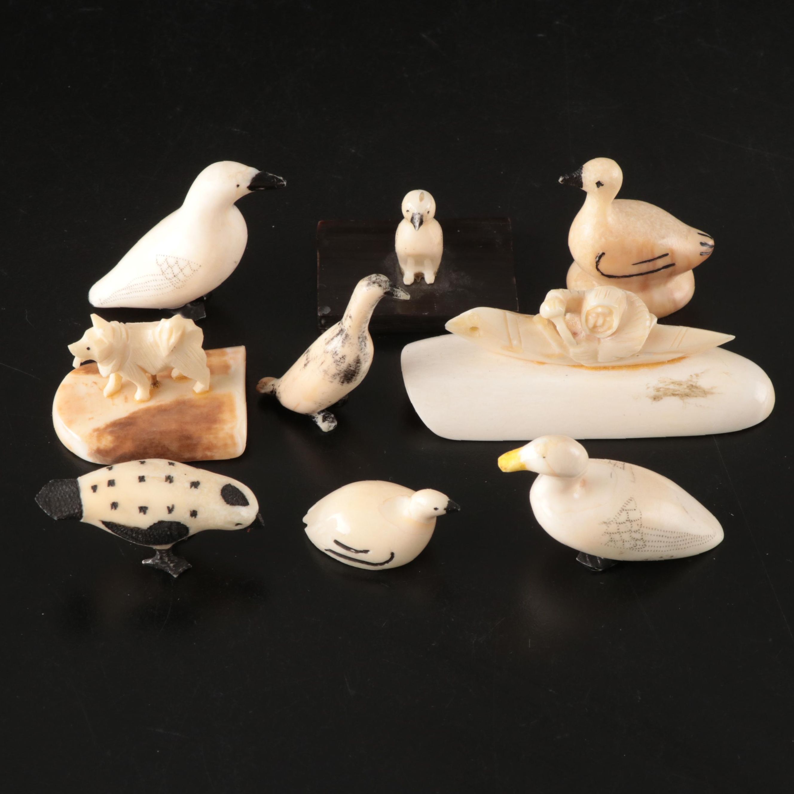 Inuit and Arctic Indigenous Carved Walrus Ivory Hunter in Kayak and Animals