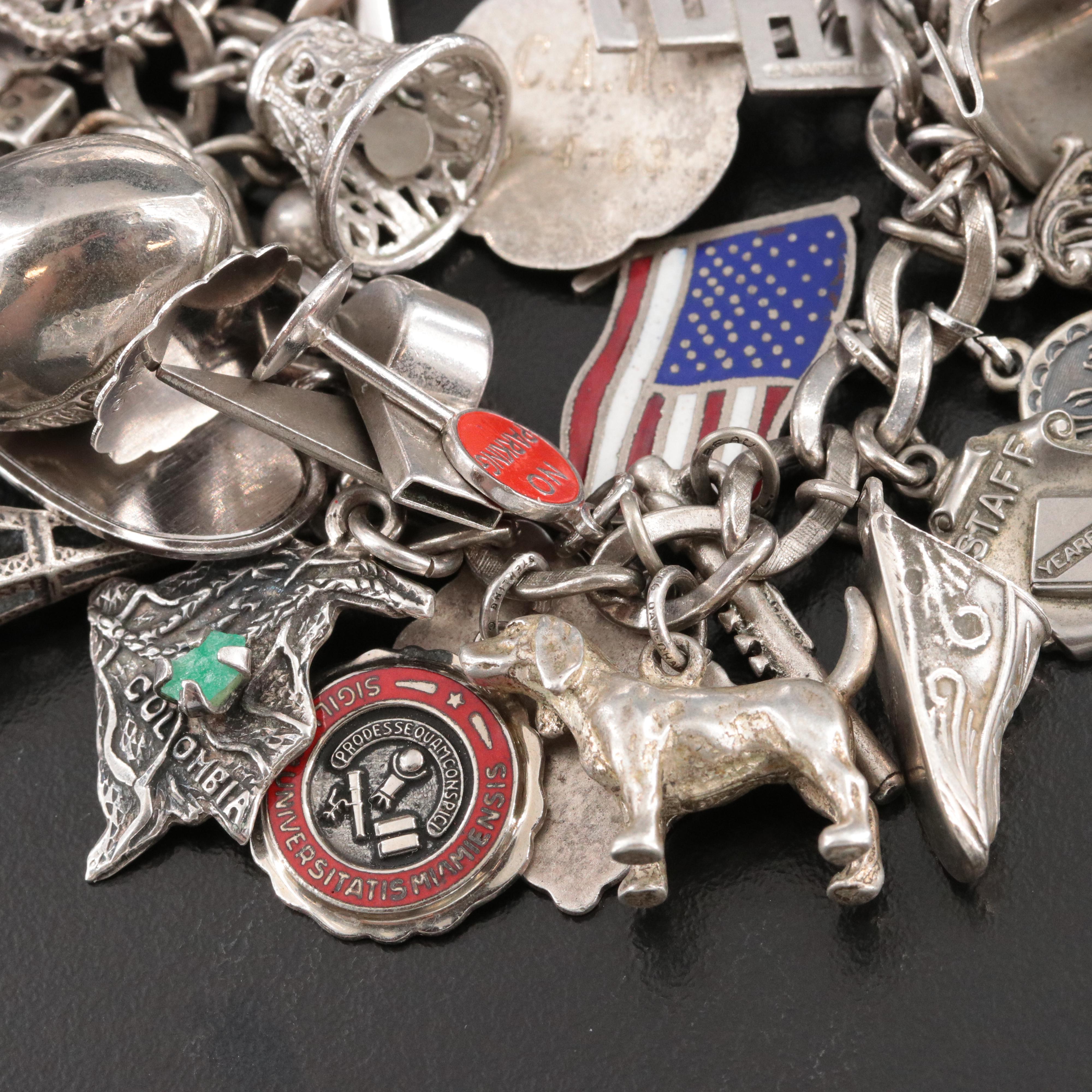 Sterling Charm Bracelet Including Emerald, Enamel and Articulated