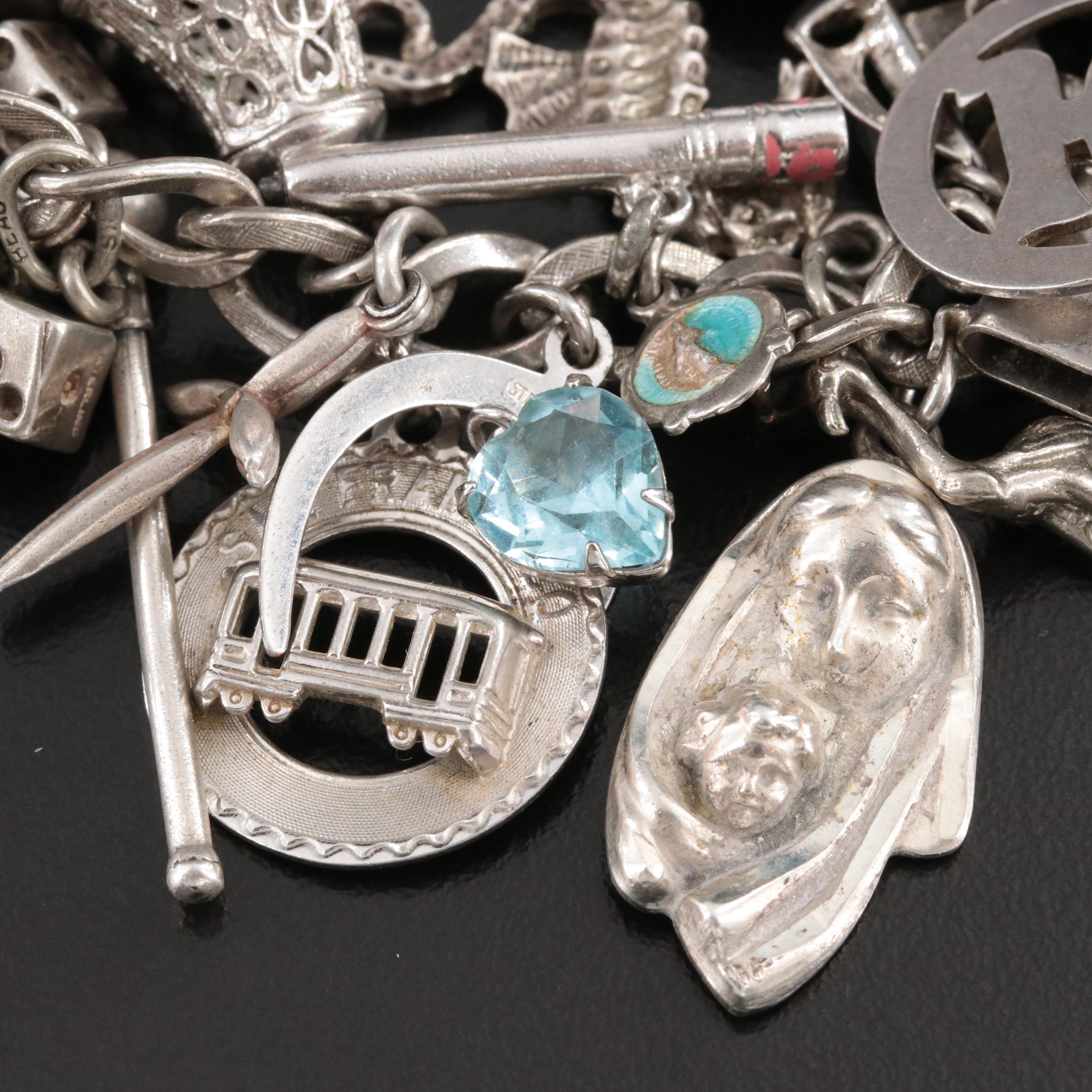 Sterling Charm Bracelet Including Emerald, Enamel and Articulated