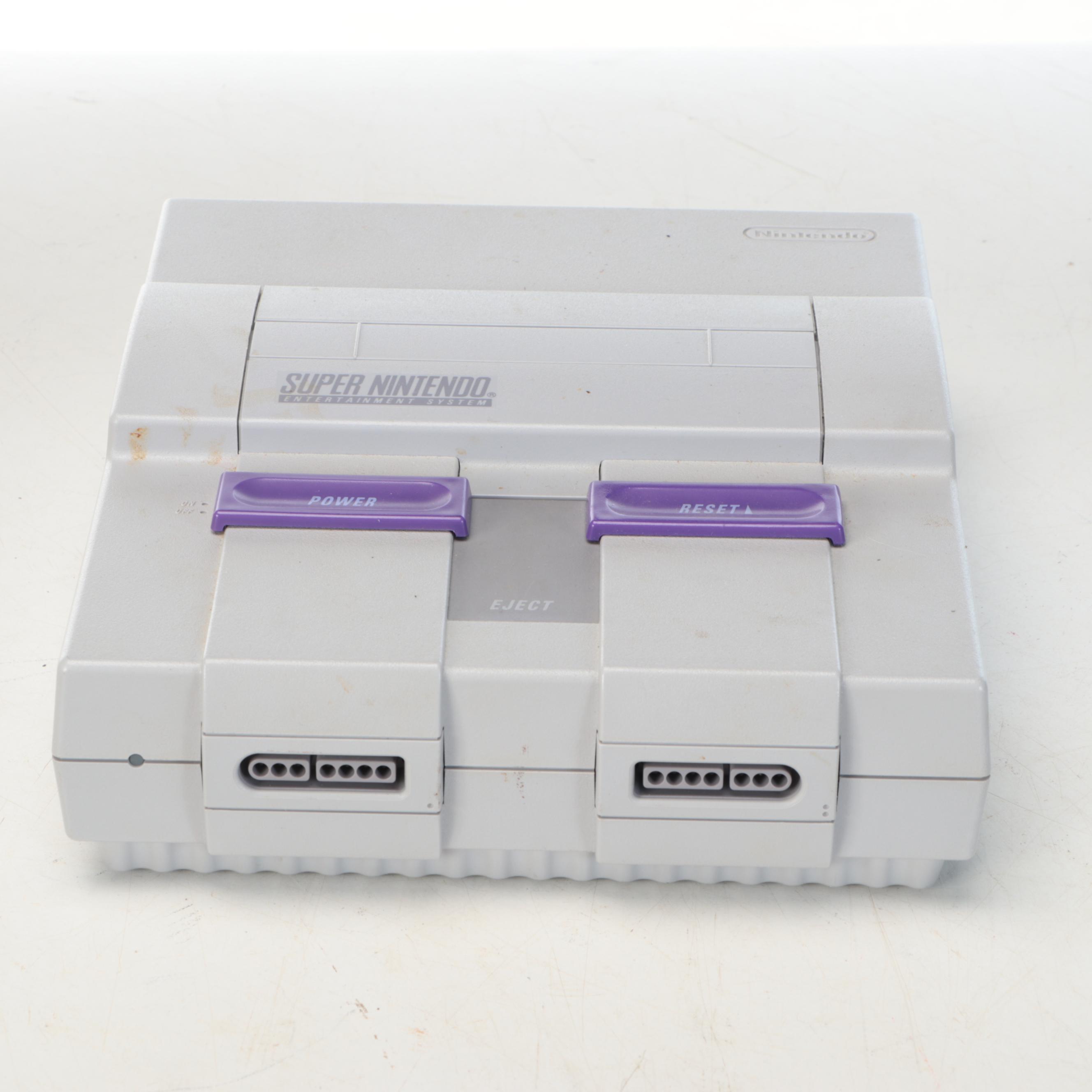 Nintendo Super NES Video Game Console with Accessories and Games, Late 20th C.