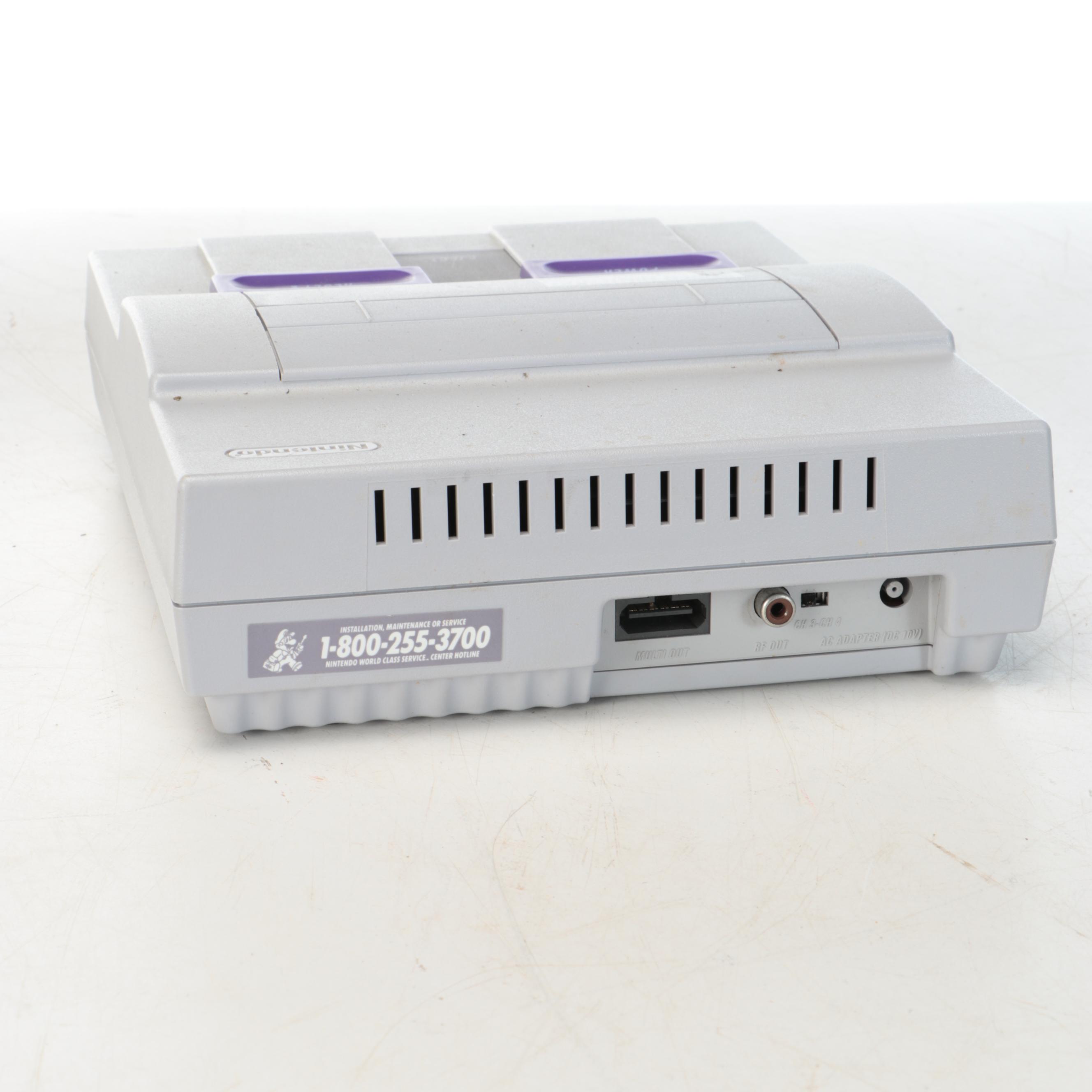 Nintendo Super NES Video Game Console with Accessories and Games, Late 20th C.
