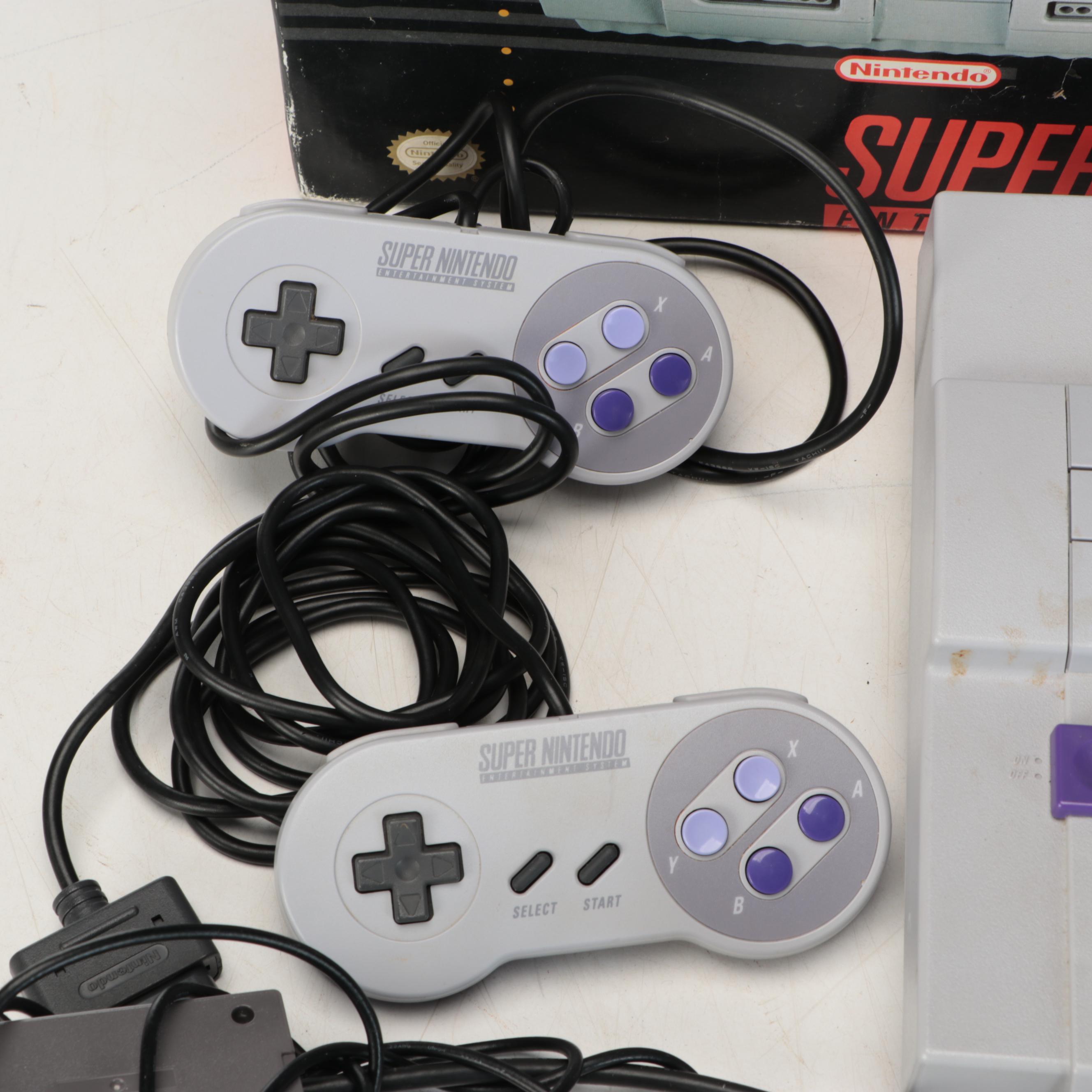 Nintendo Super NES Video Game Console with Accessories and Games, Late 20th C.