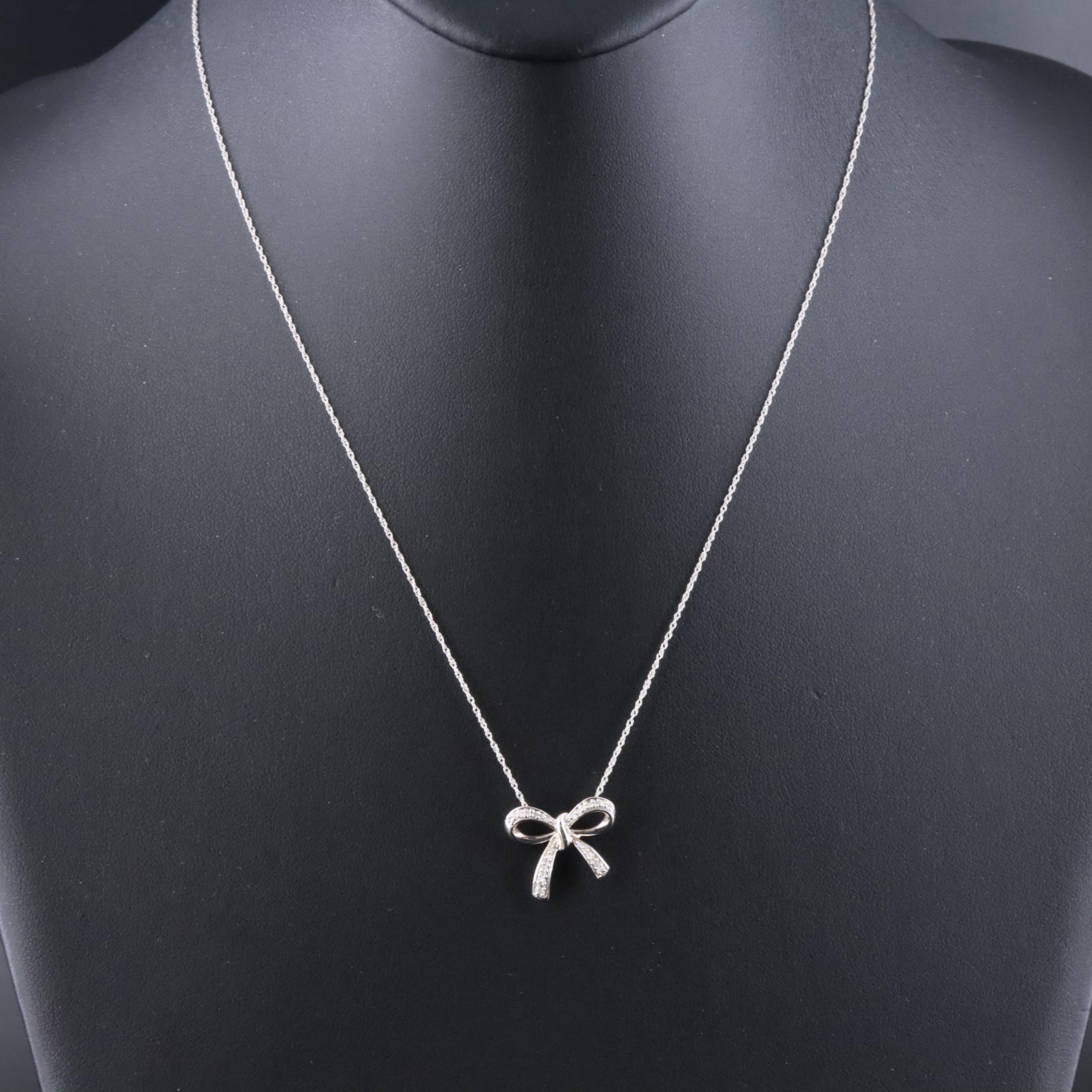 10K 0.10 CTW Diamond Bow Pendant Necklace