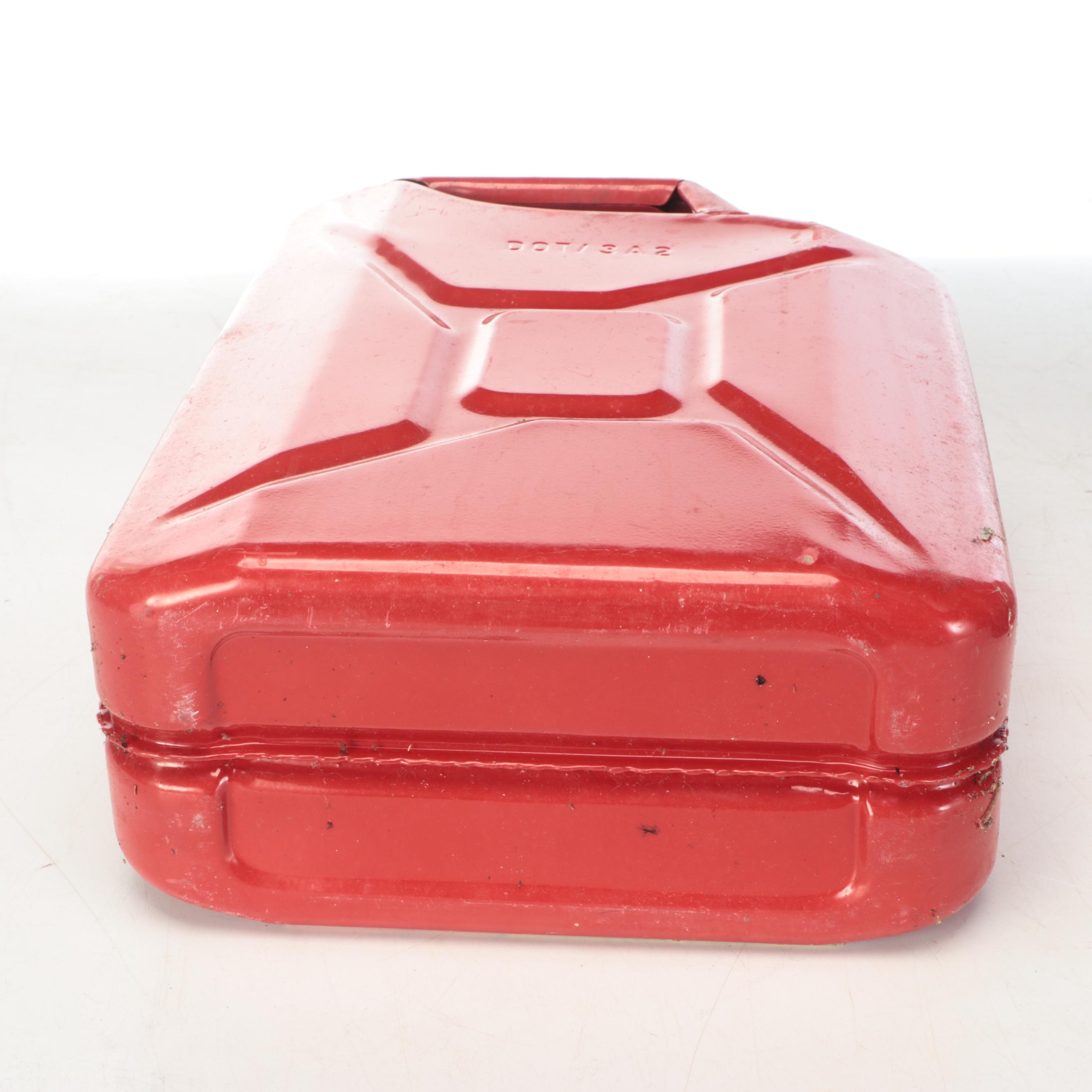 Two Red Metal Gasoline Cans