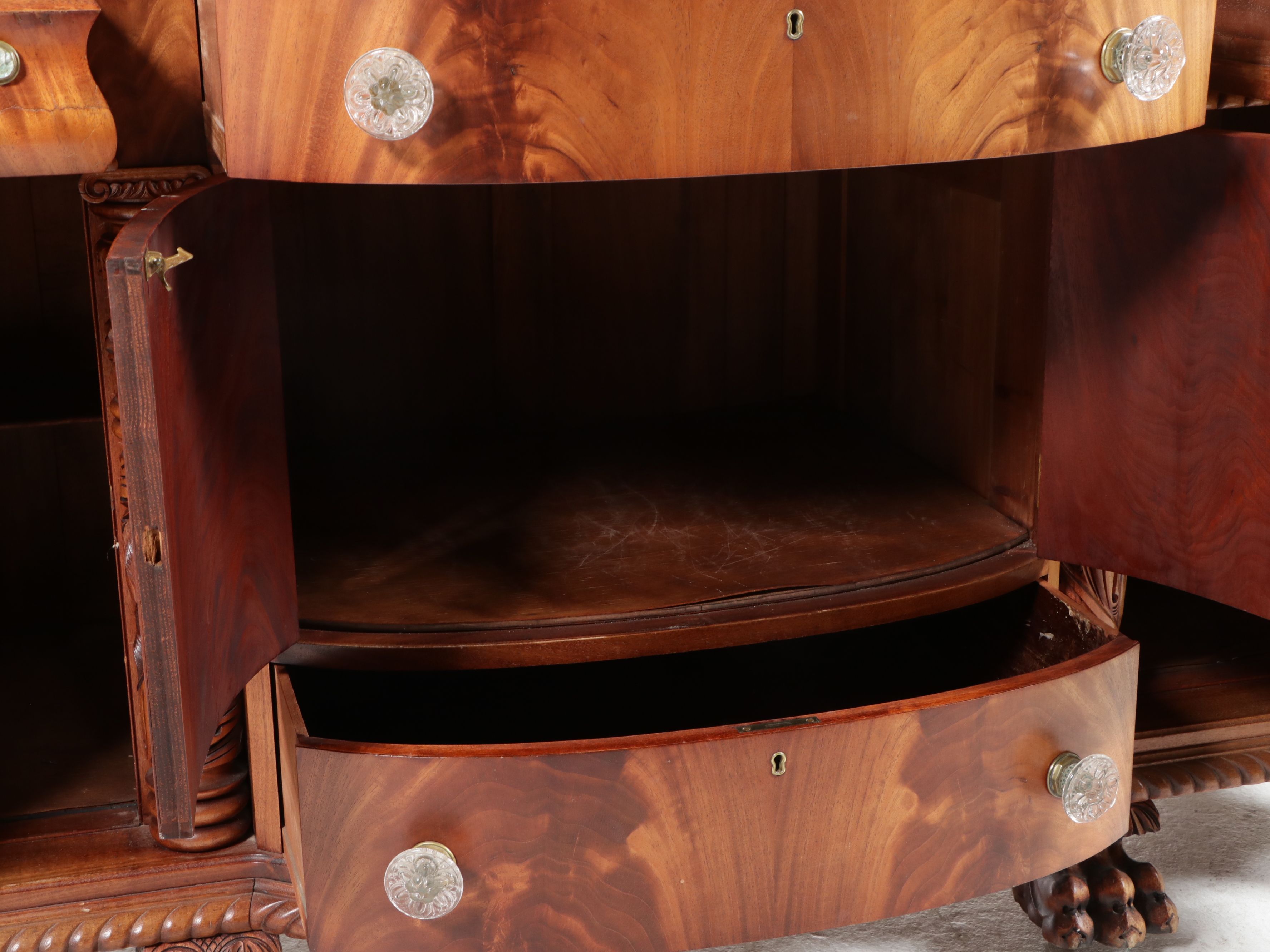 American Empire Carved Pineapple and Lions Paw Flame Mahogany Sideboard