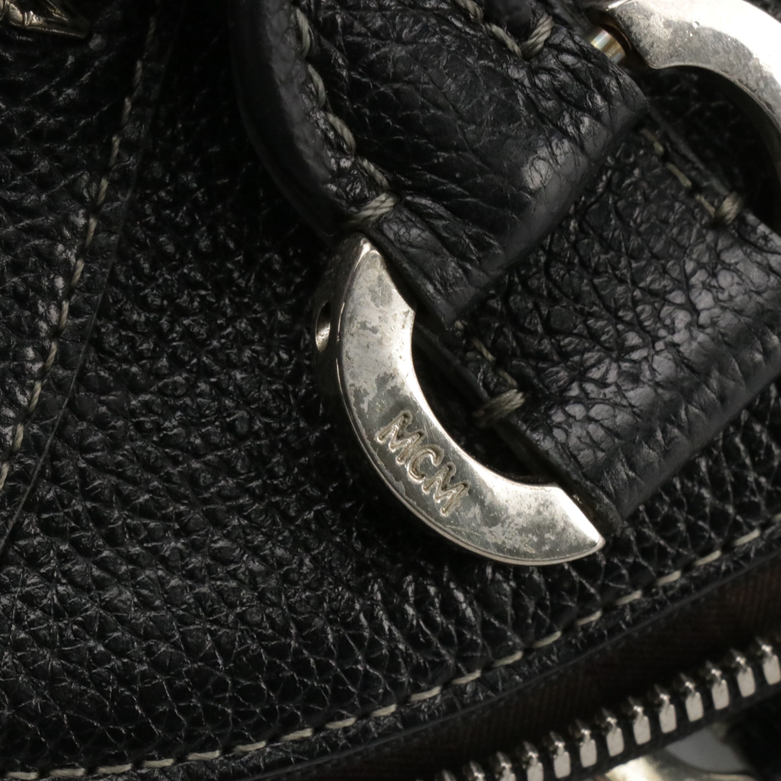 MCM Domed Boston Handbag in Logo Studded Black Leather