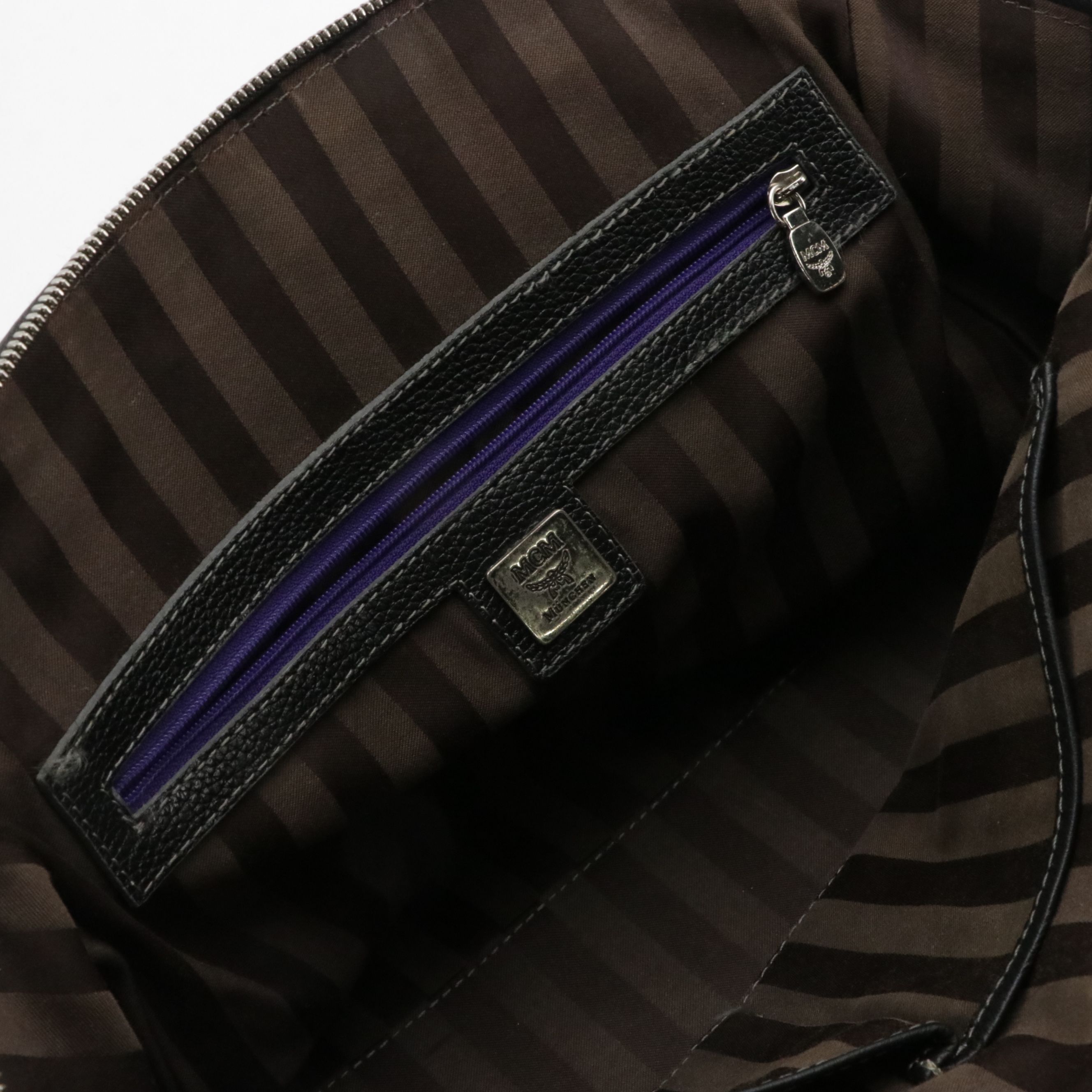 MCM Domed Boston Handbag in Logo Studded Black Leather