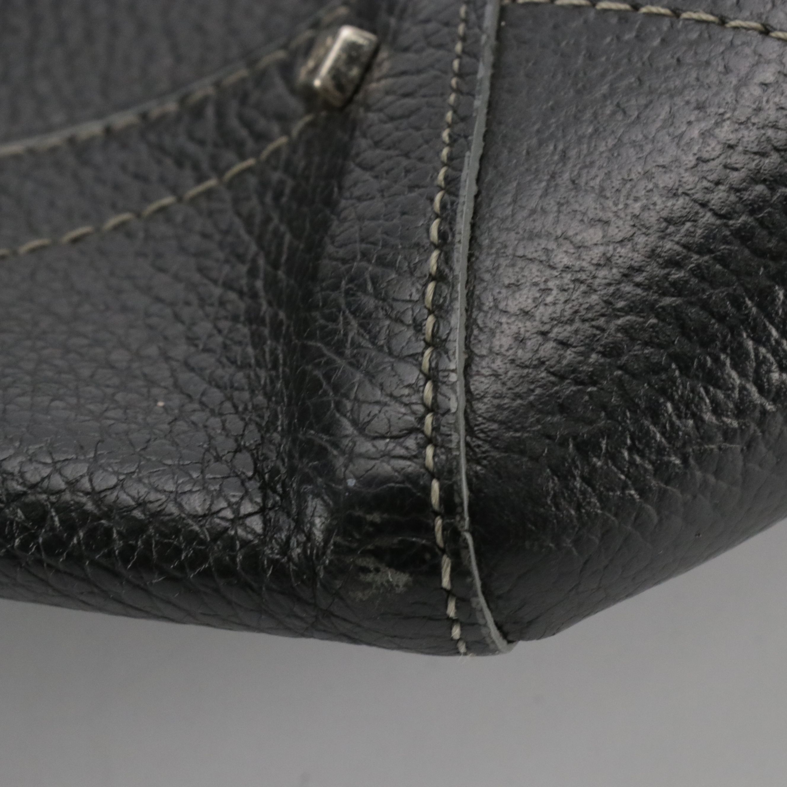 MCM Domed Boston Handbag in Logo Studded Black Leather