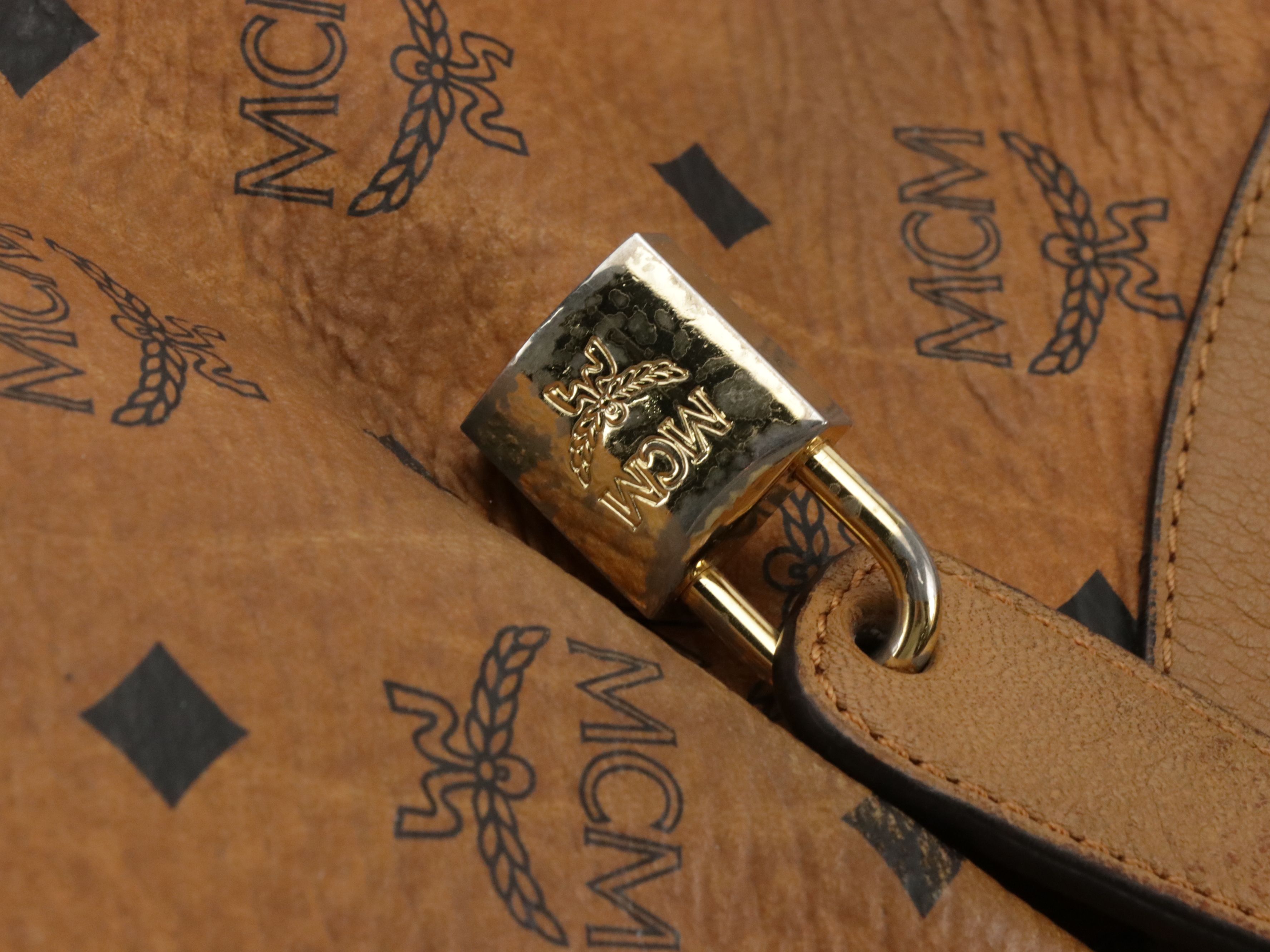 MCM Pleated Hobo Bag in Cognac Visetos Canvas with Leather Buckle Trim