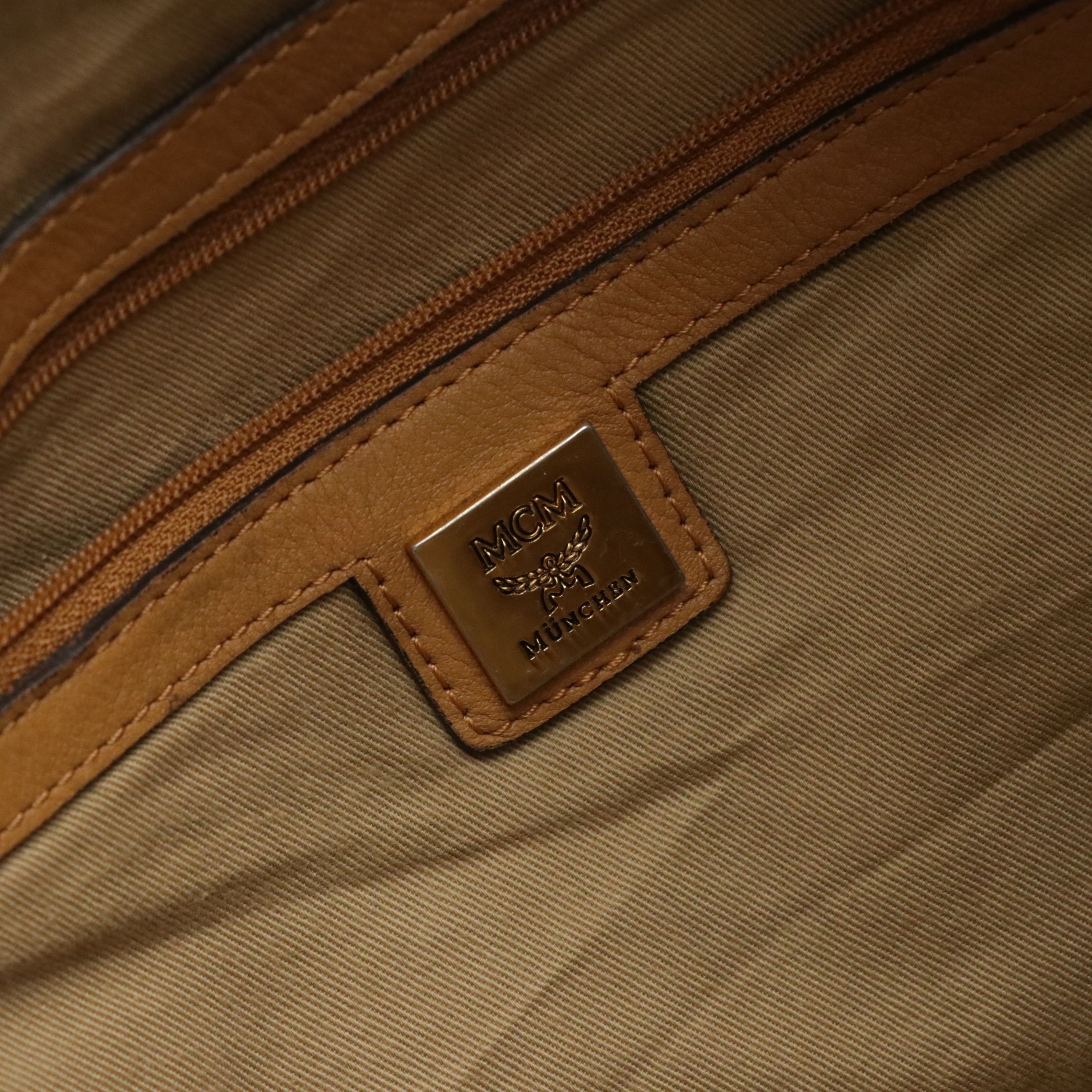 MCM Pleated Hobo Bag in Cognac Visetos Canvas with Leather Buckle Trim