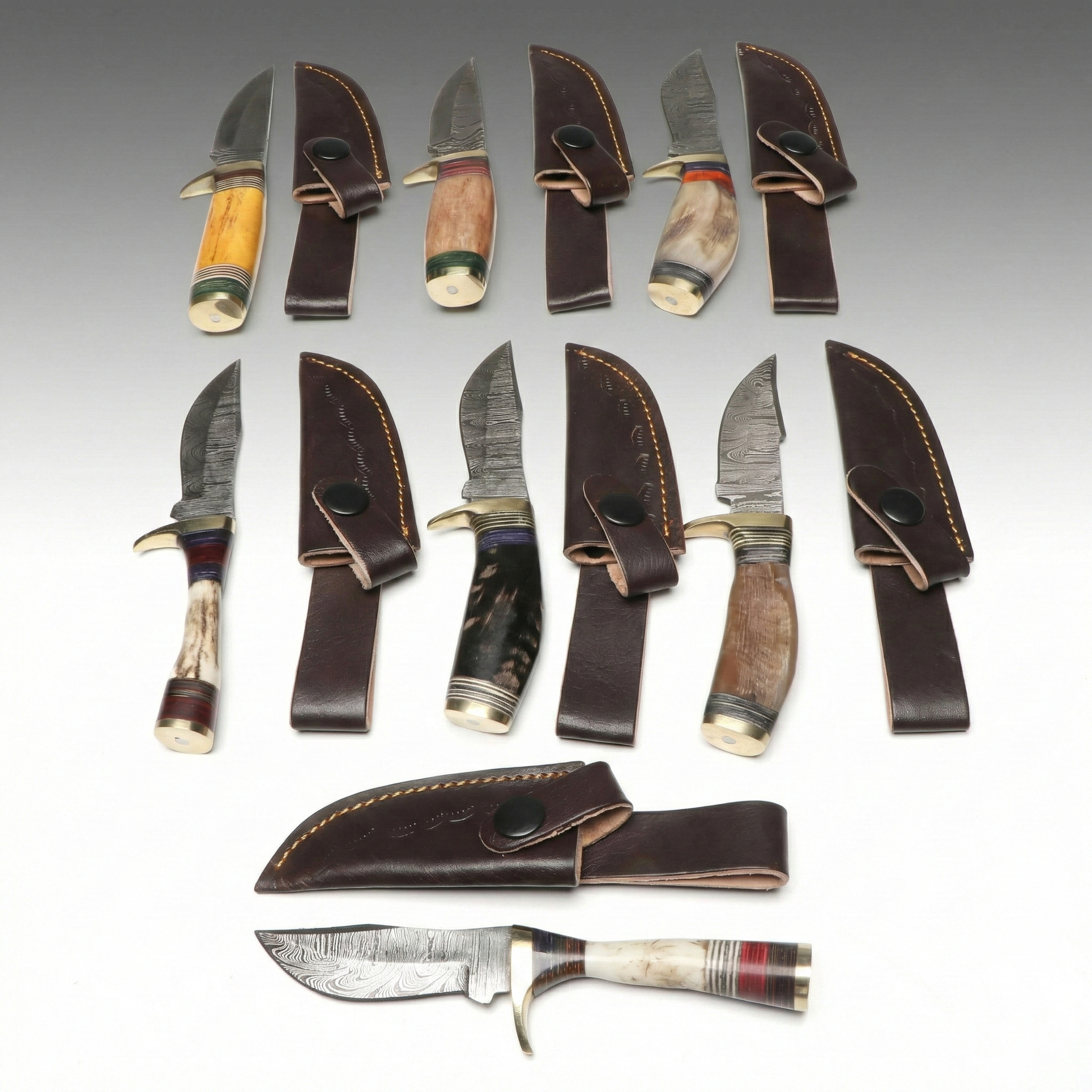 Bone and Antler Handled Damascus Steel Skinner Knives in Leather Scabbards