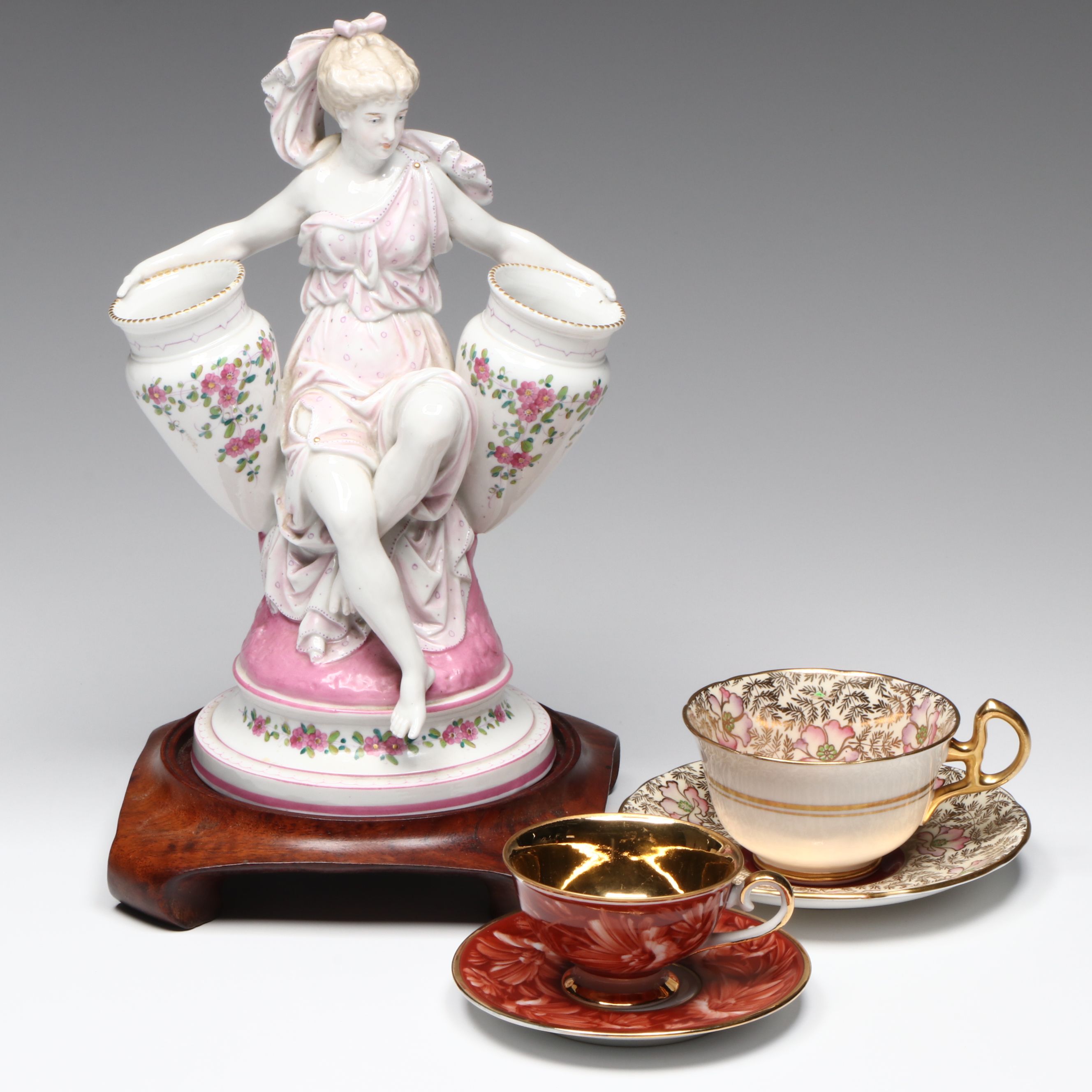French Neoclassical Style Porcelain Figure with Other Bone China Teacups