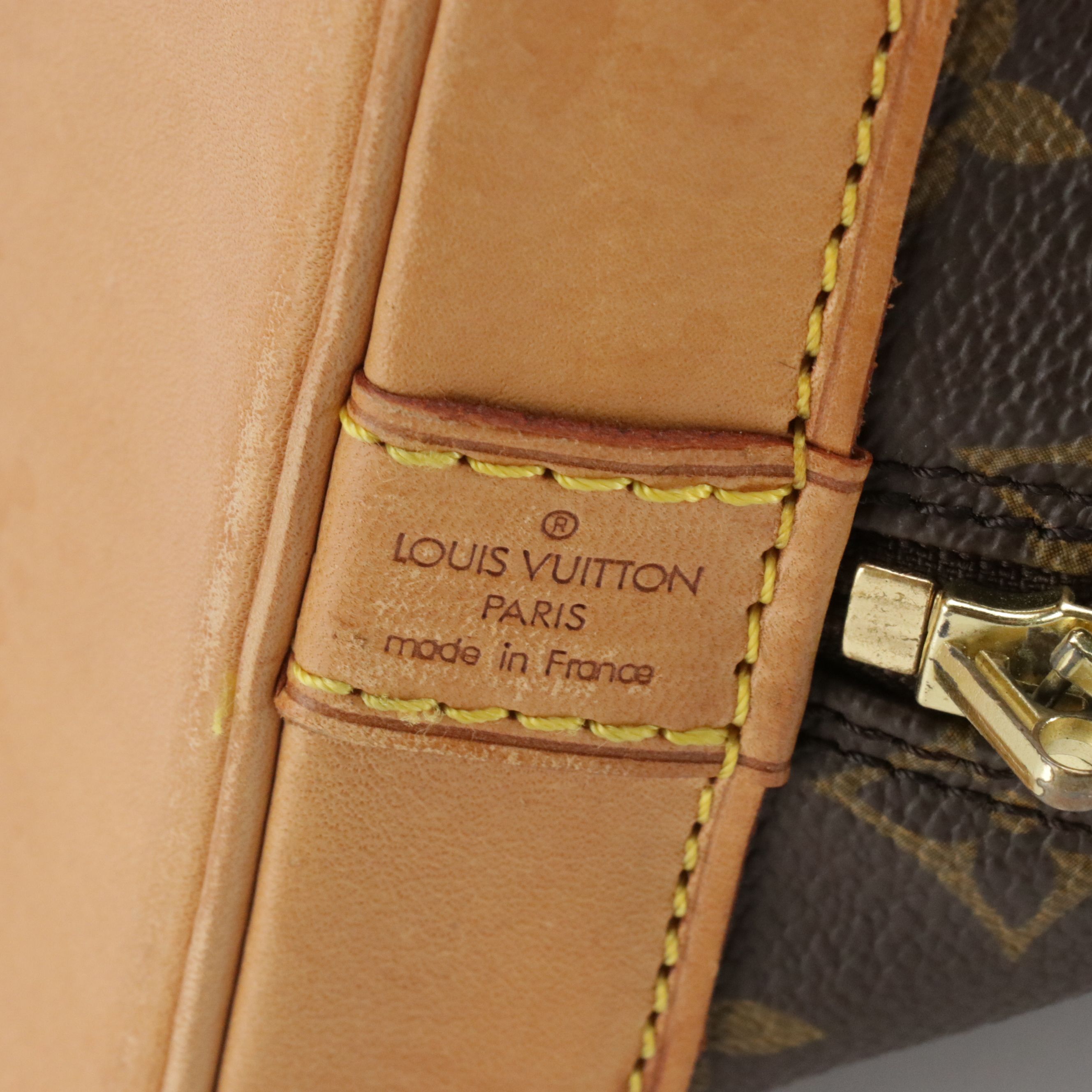 Louis Vuitton Alma PM Handbag in Monogram Canvas and Vachetta Leather